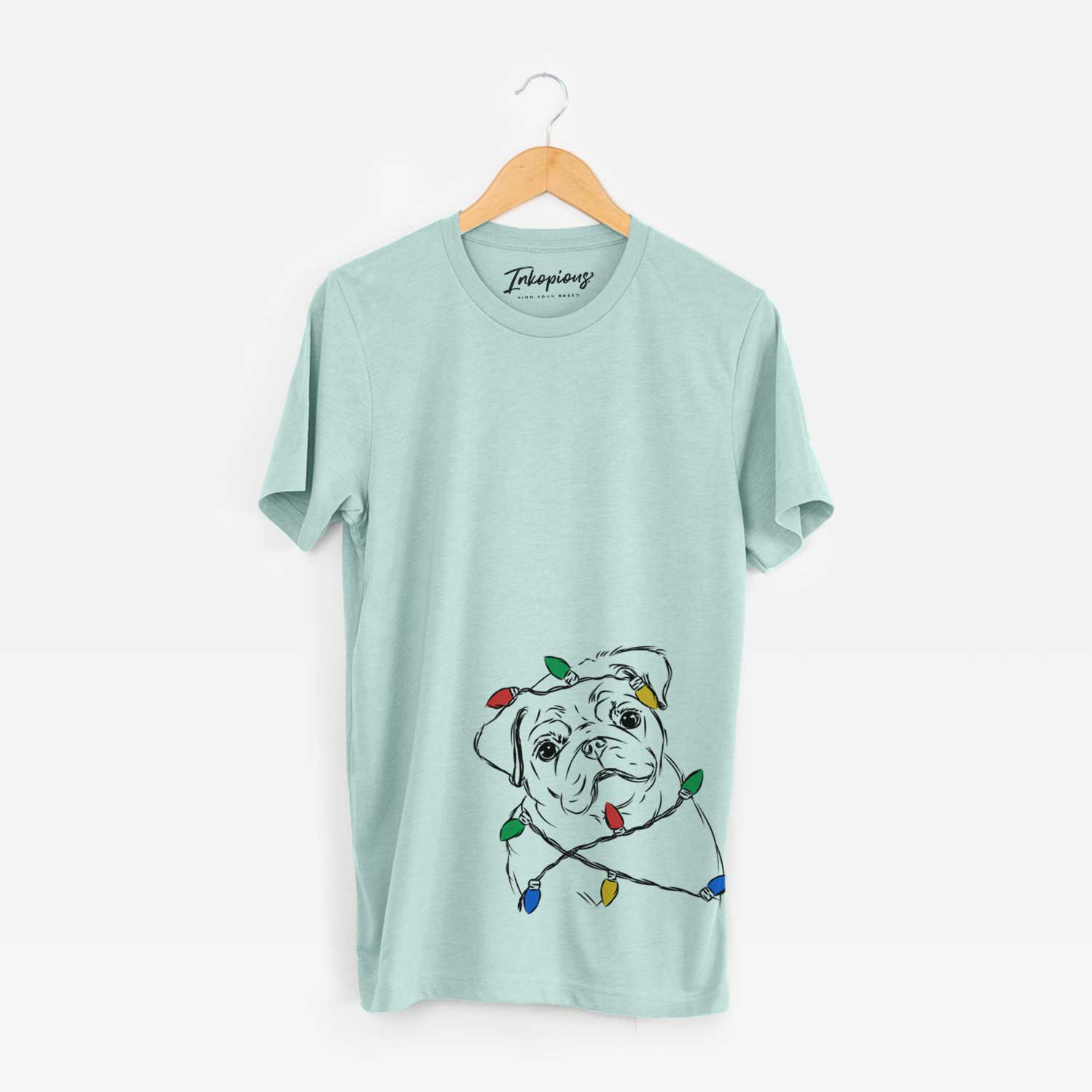 Hand-drawn sketch of Otis the Pug wrapped in Christmas lights on a Heather Sage Unisex crewneck