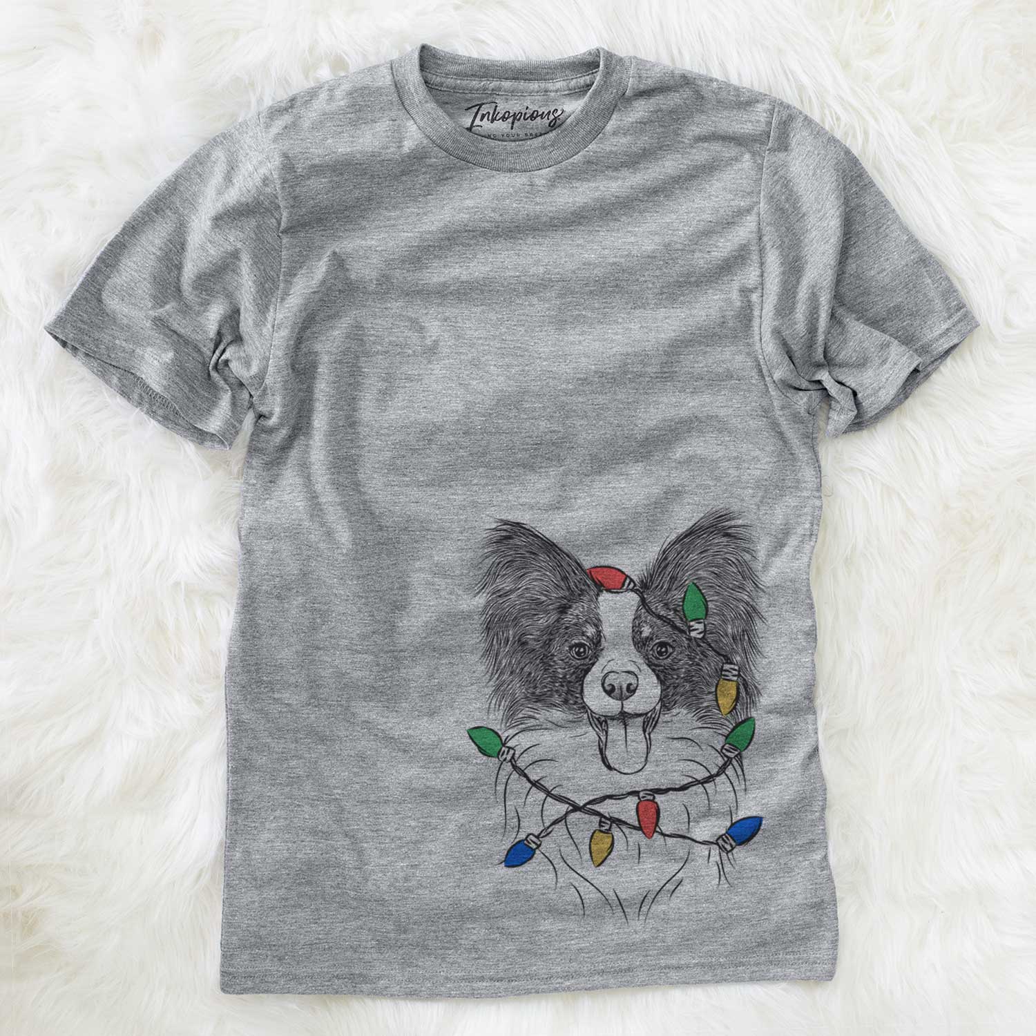 Hand-drawn sketch of Patrick the Papillon wrapped in Christmas lights on a Grey Unisex crewneck