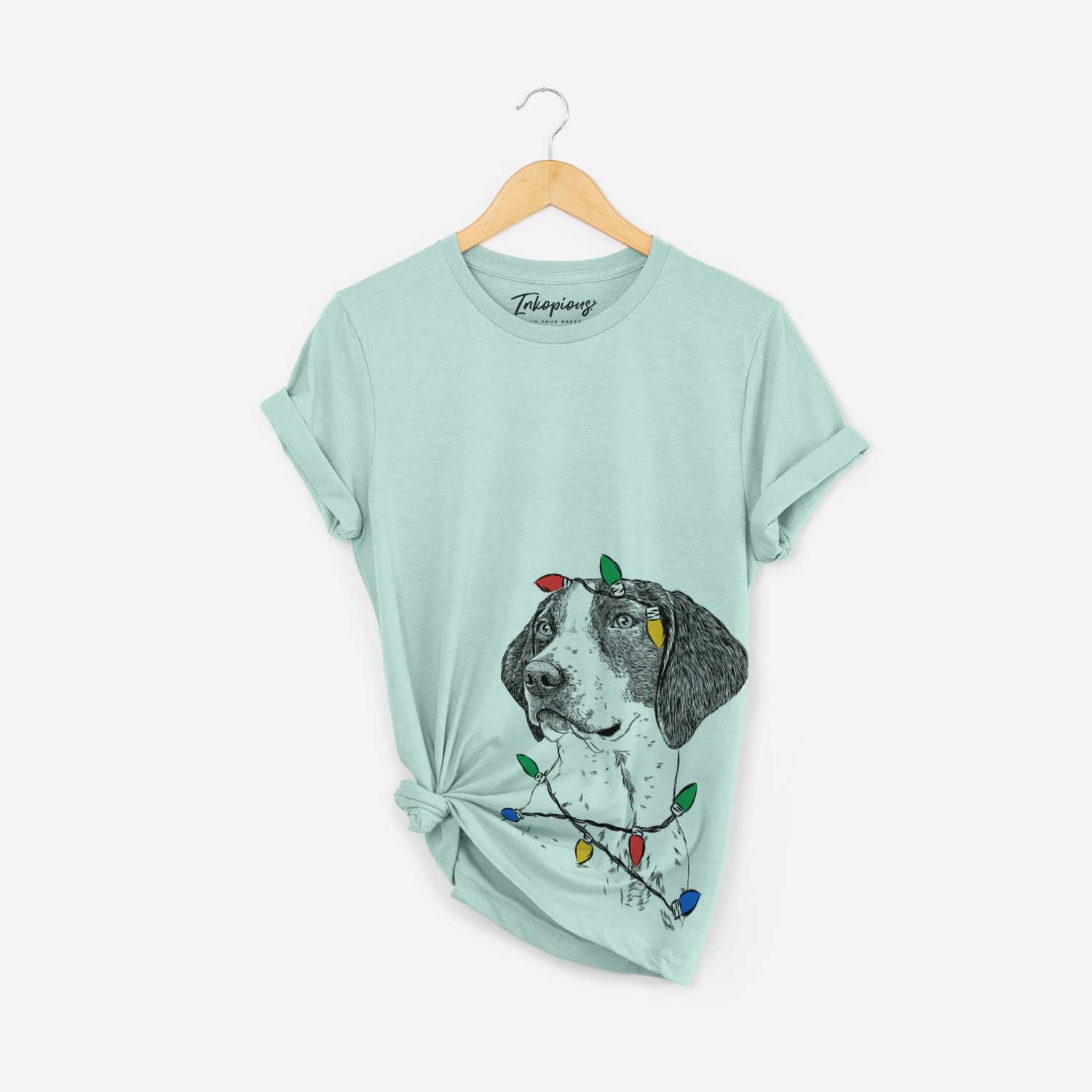 Hand-drawn sketch of Payton the Mixed Breed wrapped in Christmas lights on a Heather Sage Unisex crewneck