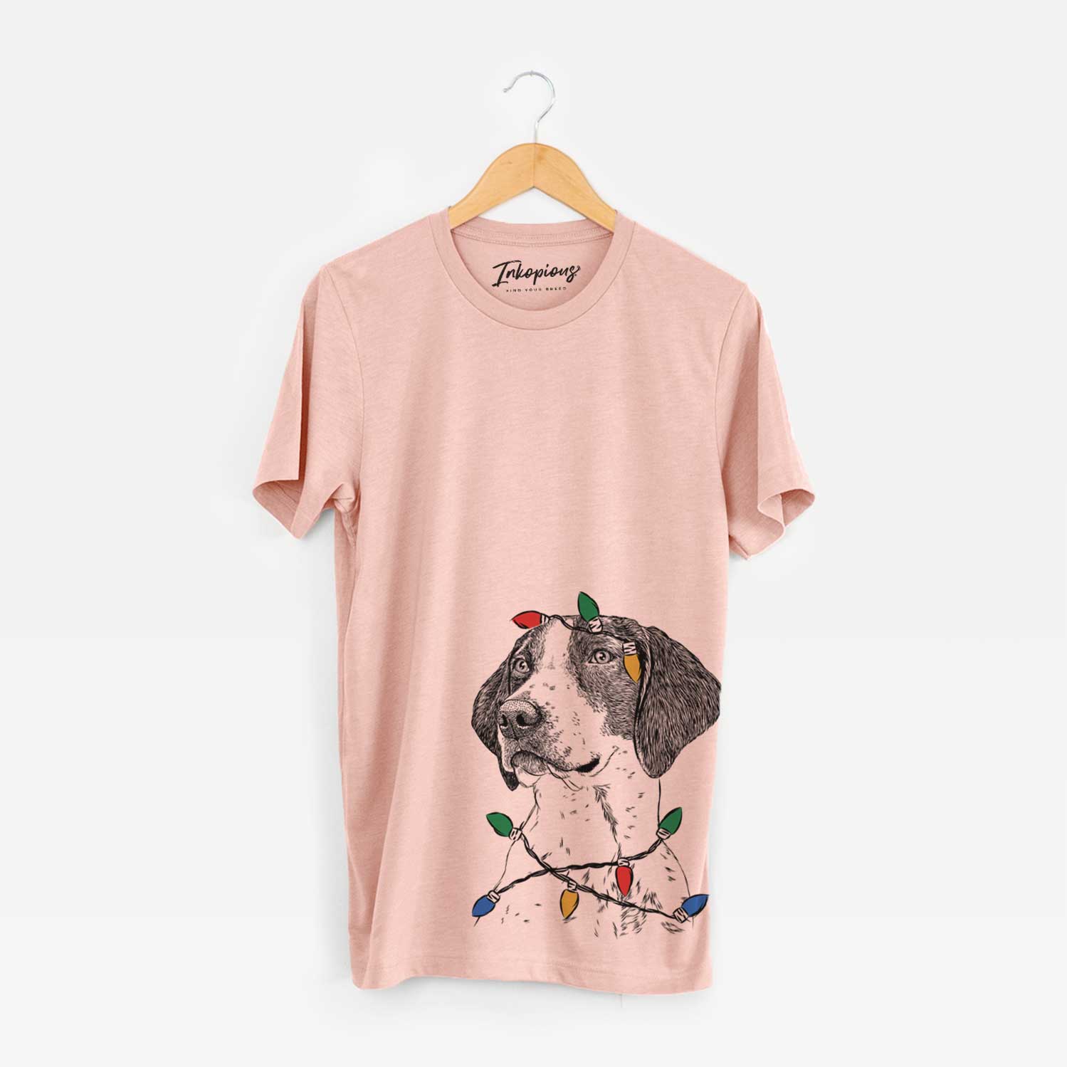 Hand-drawn sketch of Payton the Mixed Breed wrapped in Christmas lights on a Peach Unisex crewneck