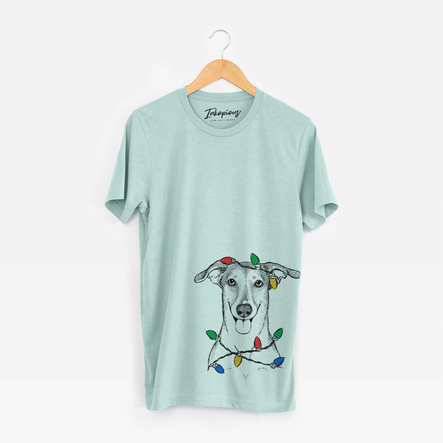 Hand-drawn sketch of Phoebe the Corgi Mix wrapped in Christmas lights on a Heather Sage Unisex crewneck