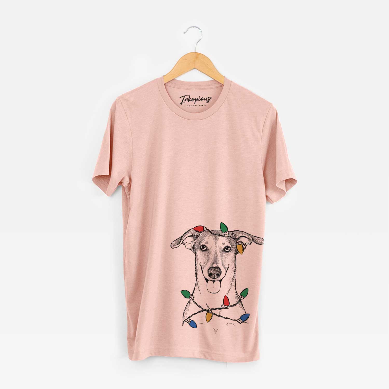 Hand-drawn sketch of Phoebe the Corgi Mix wrapped in Christmas lights on a Peach Unisex crewneck