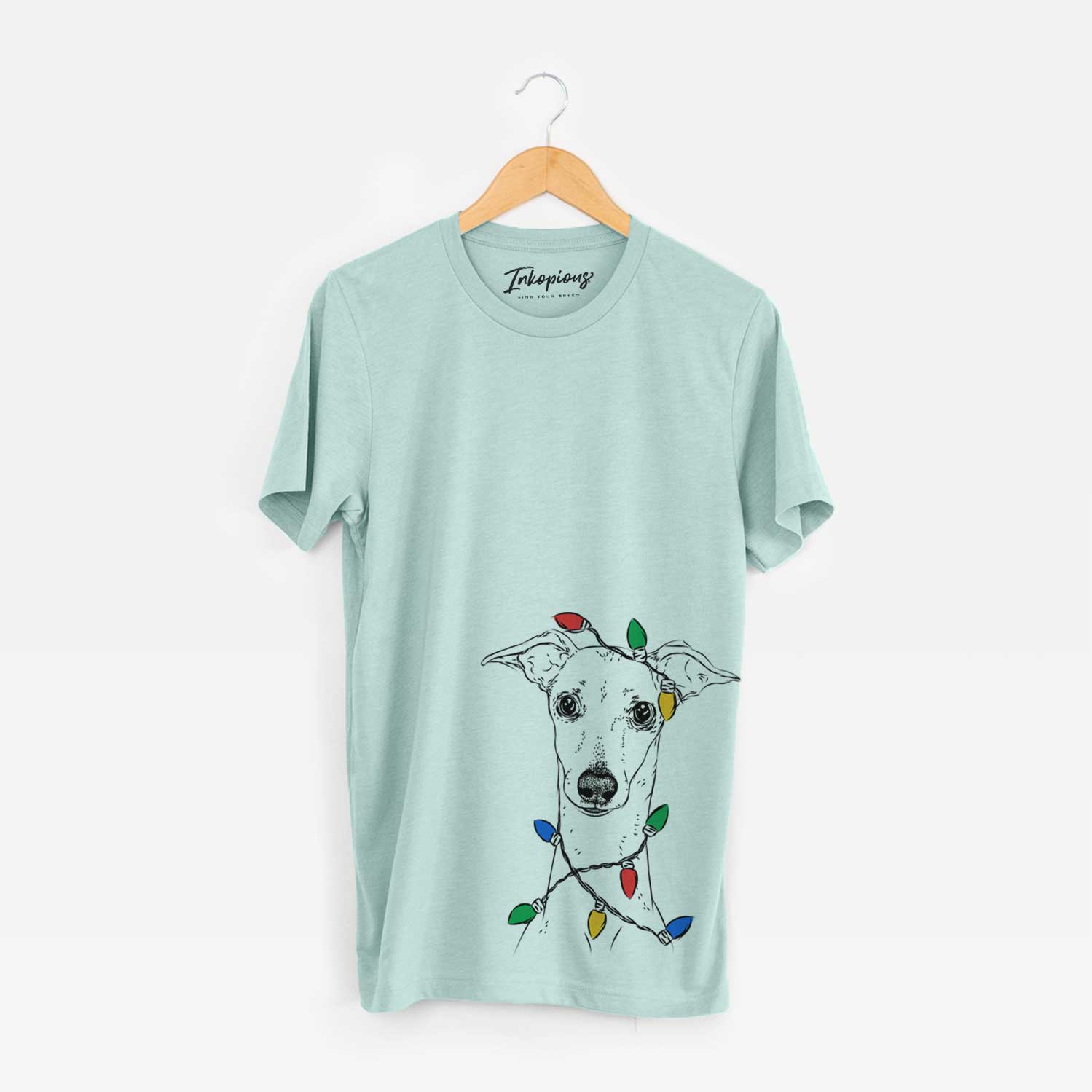 Hand-drawn sketch of Pip the Italian Greyhound wrapped in Christmas lights on a Heather Sage Unisex crewneck