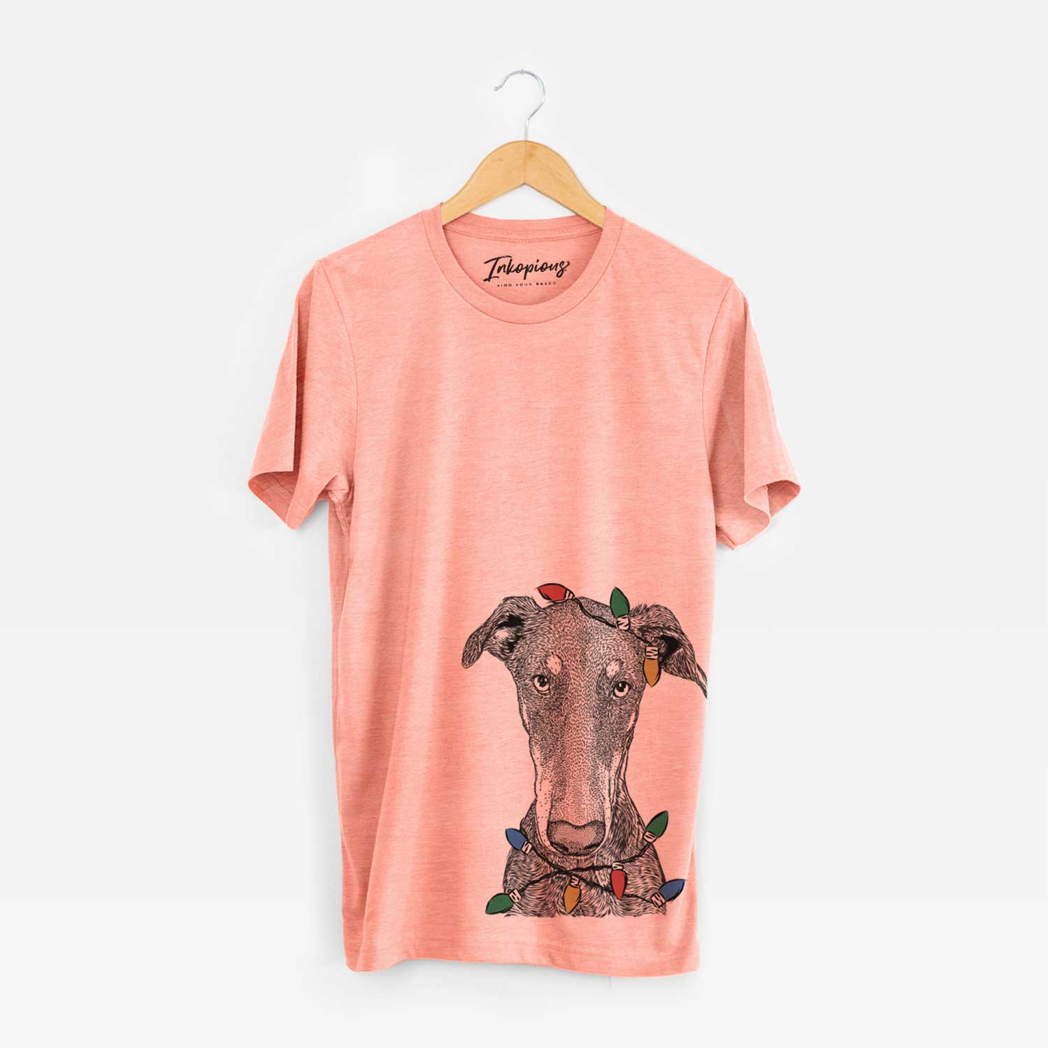 Hand-drawn sketch of Princess Fiona the Doberman Pinscher wrapped in Christmas lights on a Sunset Unisex crewneck
