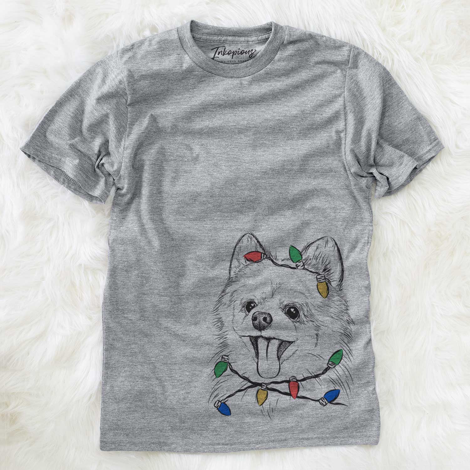 Hand-drawn sketch of Quinn the Pomeranian wrapped in Christmas lights on a Grey Unisex crewneck