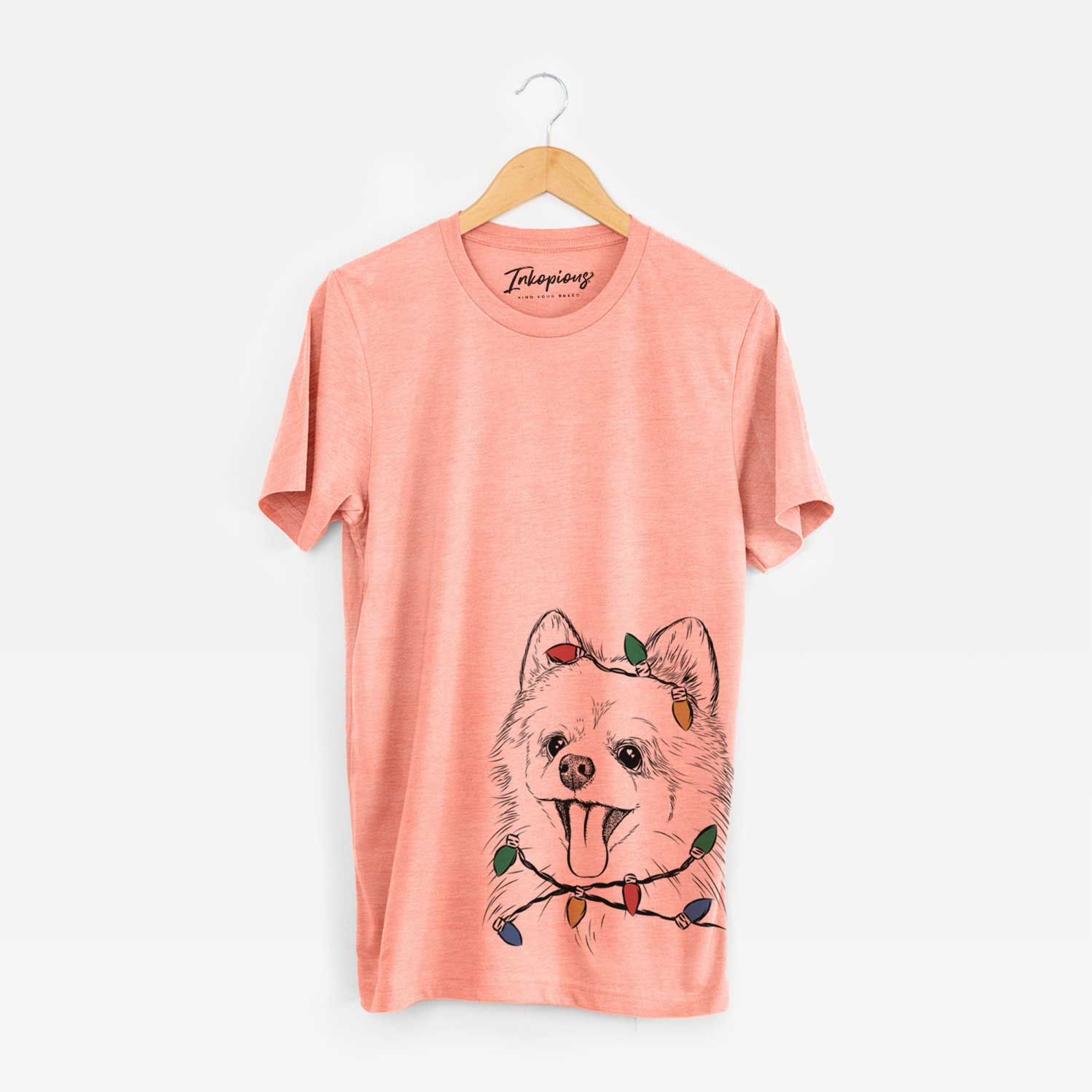Hand-drawn sketch of Quinn the Pomeranian wrapped in Christmas lights on a Sunset Unisex crewneck