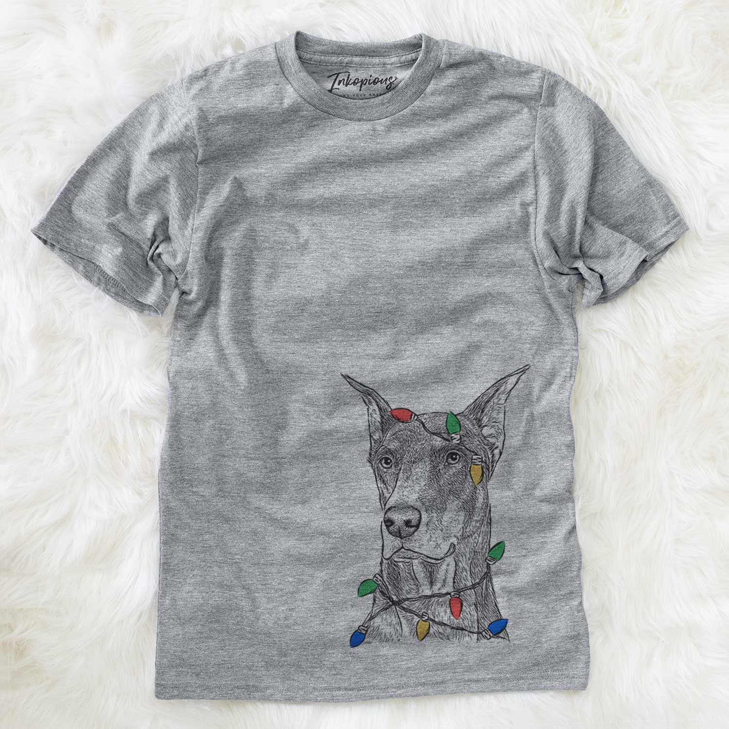 Hand-drawn sketch of RJ the Doberman Pinscher wrapped in Christmas lights on a Grey Unisex crewneck