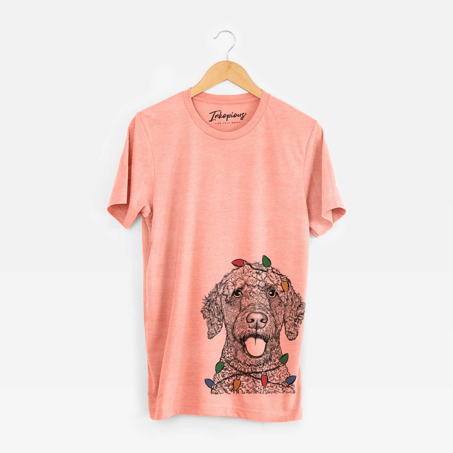 Hand-drawn sketch of Reina the Spanish Water Dog wrapped in Christmas lights on a Sunset Unisex crewneck