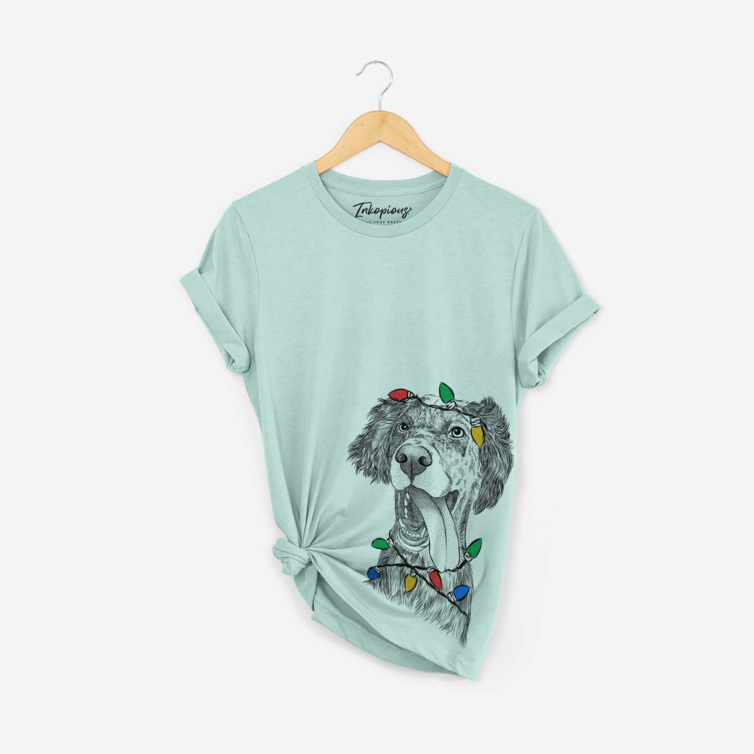 Hand-drawn sketch of Renly the English Setter wrapped in Christmas lights on a Heather Sage Unisex crewneck