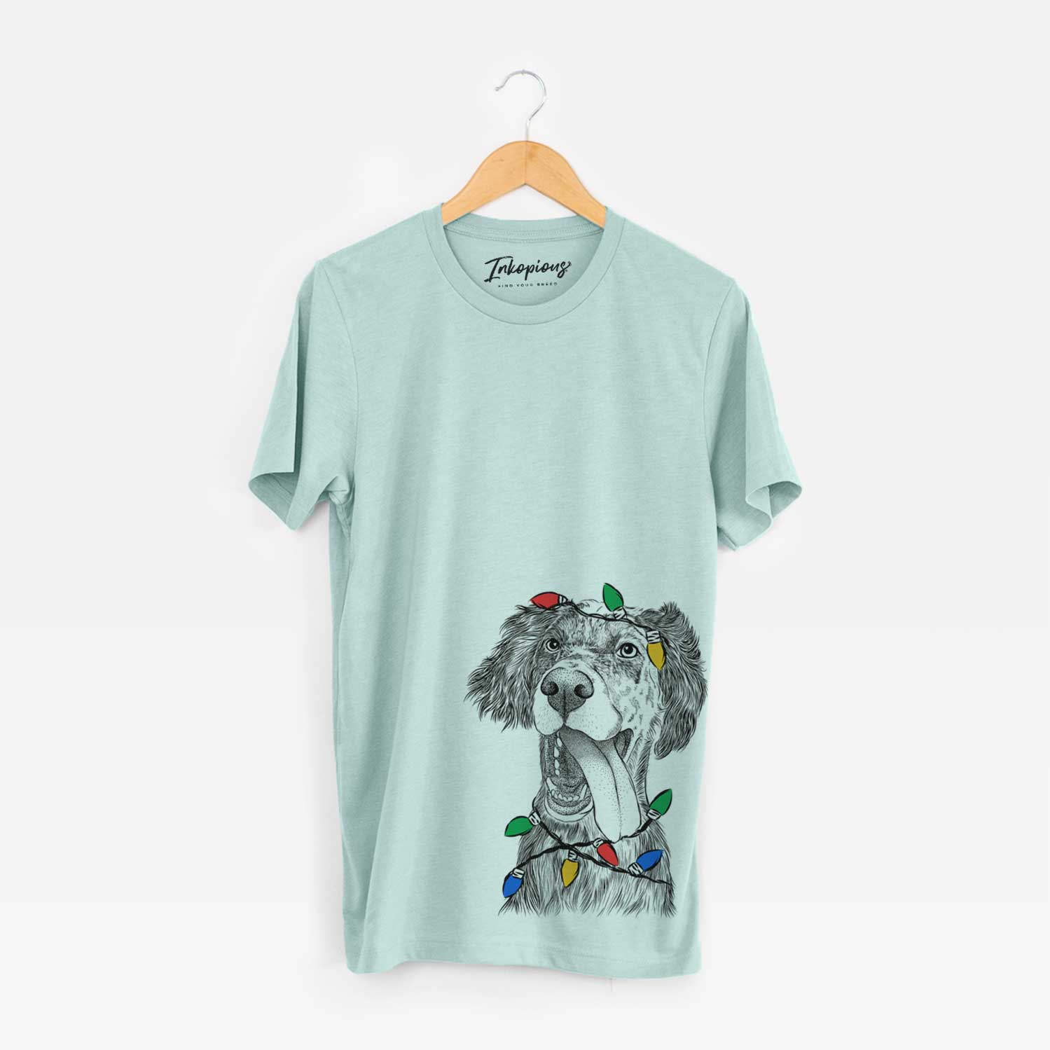 Hand-drawn sketch of Renly the English Setter wrapped in Christmas lights on a Heather Sage Unisex crewneck