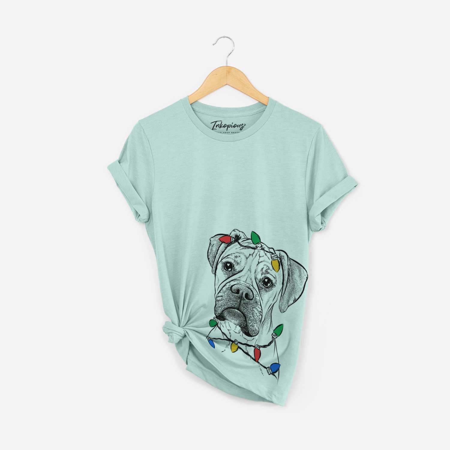 Hand-drawn sketch of Reuby the Boxer wrapped in Christmas lights on a Heather Sage Unisex crewneck
