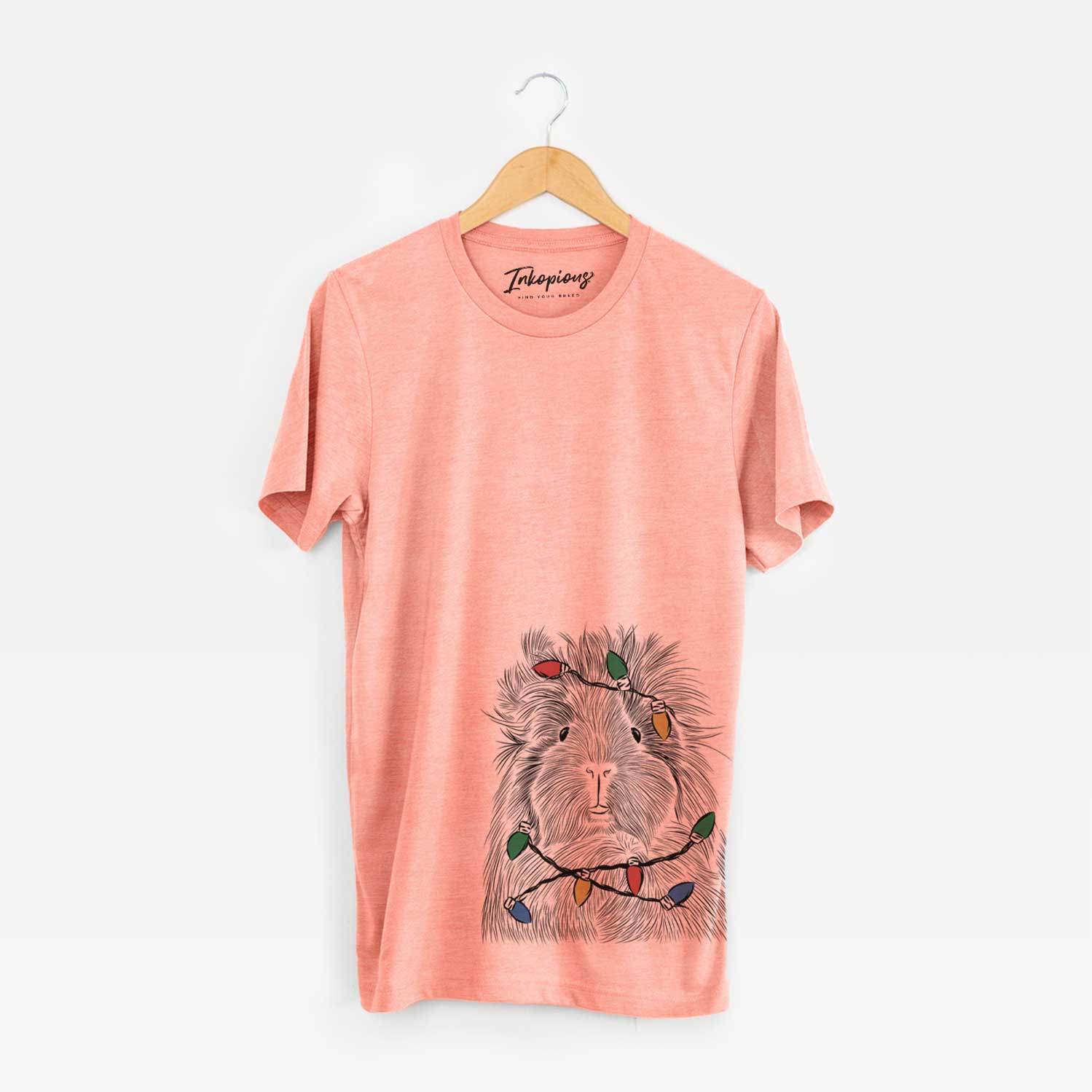Hand-drawn sketch of Rhino the Guinea Pig wrapped in Christmas lights on a Sunset Unisex crewneck