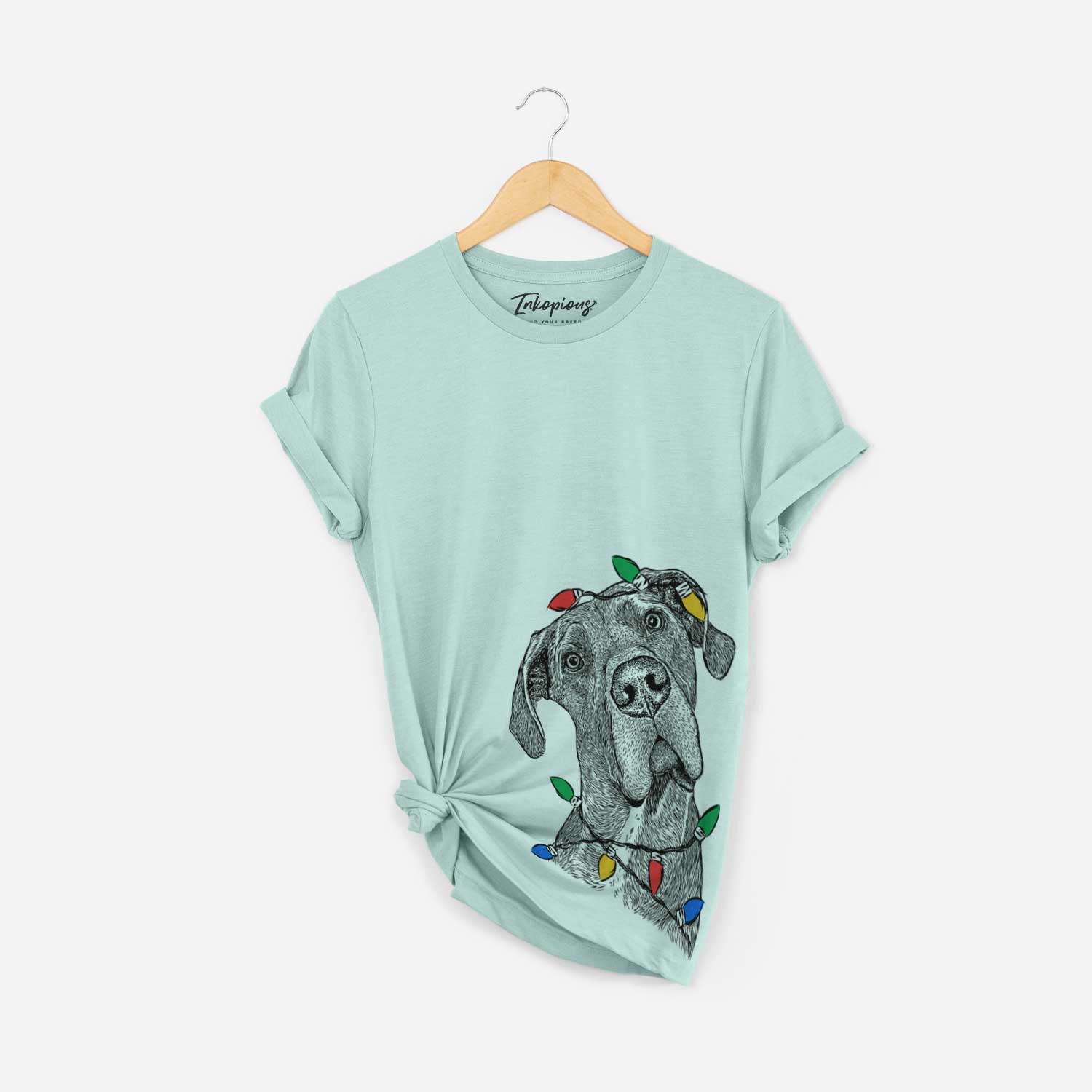 Hand-drawn sketch of River the Great Dane wrapped in Christmas lights on a Heather Sage Unisex crewneck