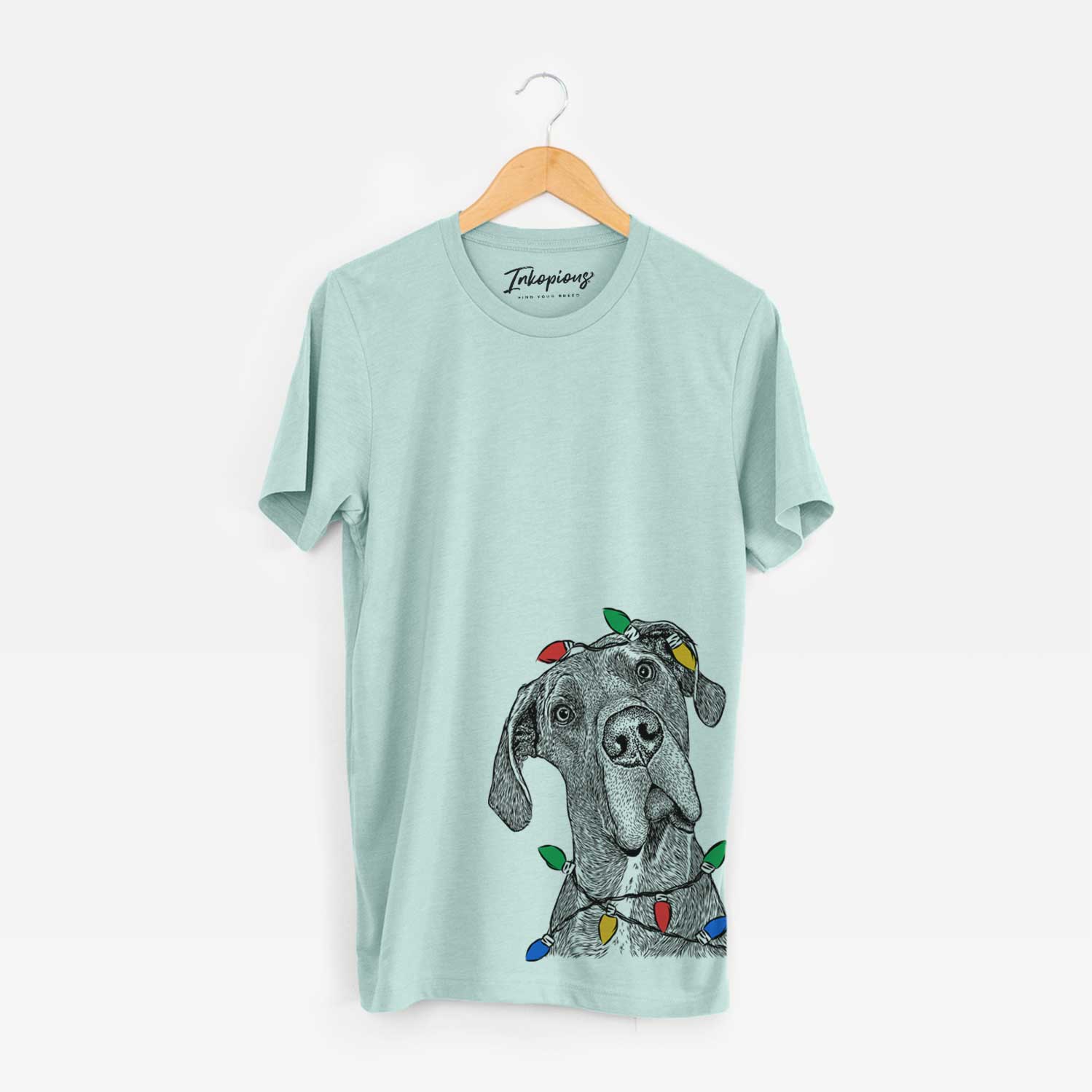 Hand-drawn sketch of River the Great Dane wrapped in Christmas lights on a Heather Sage Unisex crewneck