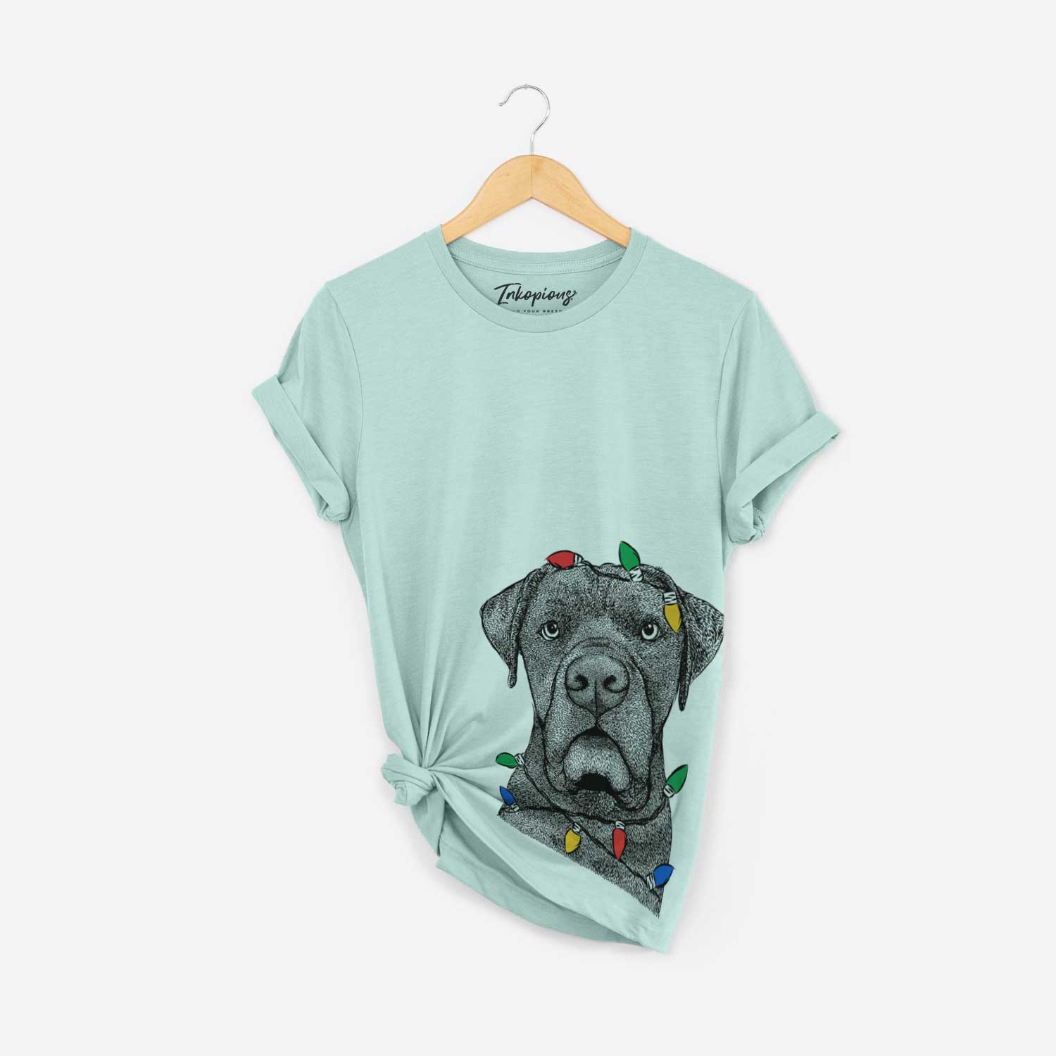 Hand-drawn sketch of Rocco the Cane Corso wrapped in Christmas lights on a Heather Sage Unisex crewneck