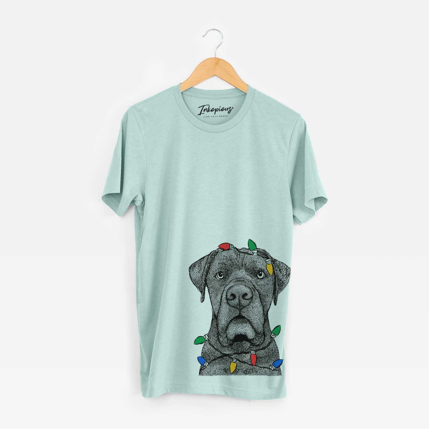 Hand-drawn sketch of Rocco the Cane Corso wrapped in Christmas lights on a Heather Sage Unisex crewneck