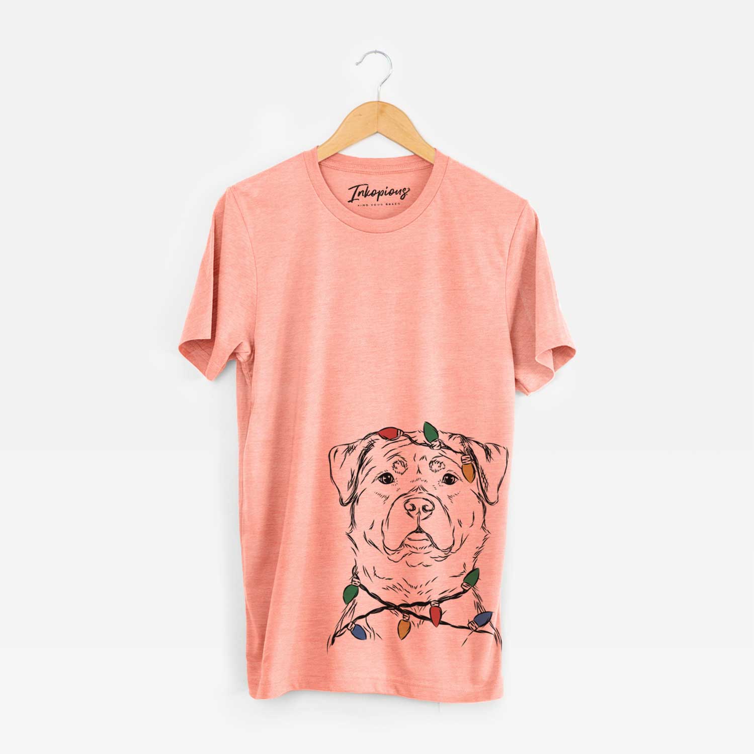 Hand-drawn sketch of Rocky the Rottweiler wrapped in Christmas lights on a Sunset Unisex crewneck