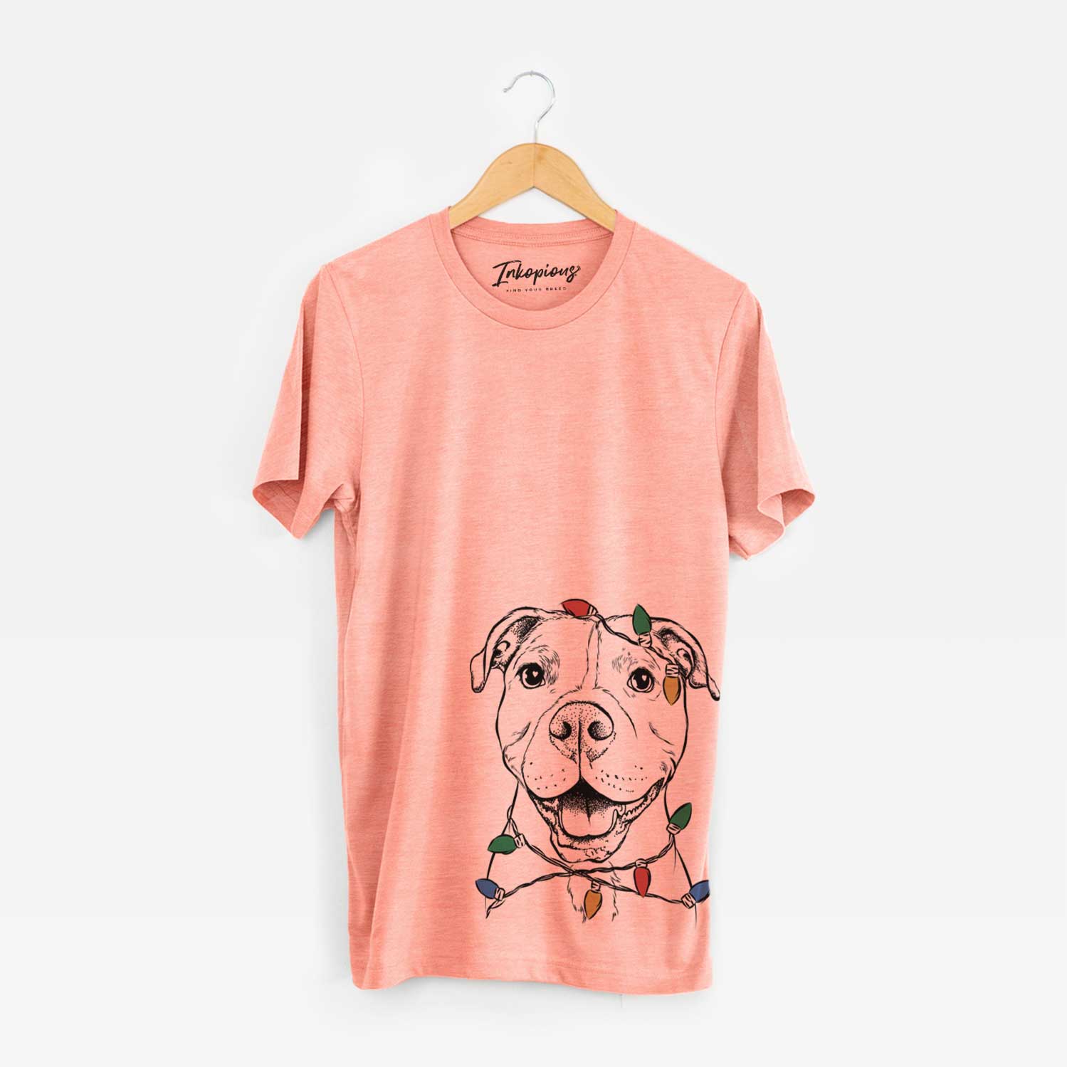Hand-drawn sketch of Roscoe the Pitbull wrapped in Christmas lights on a Sunset Unisex crewneck