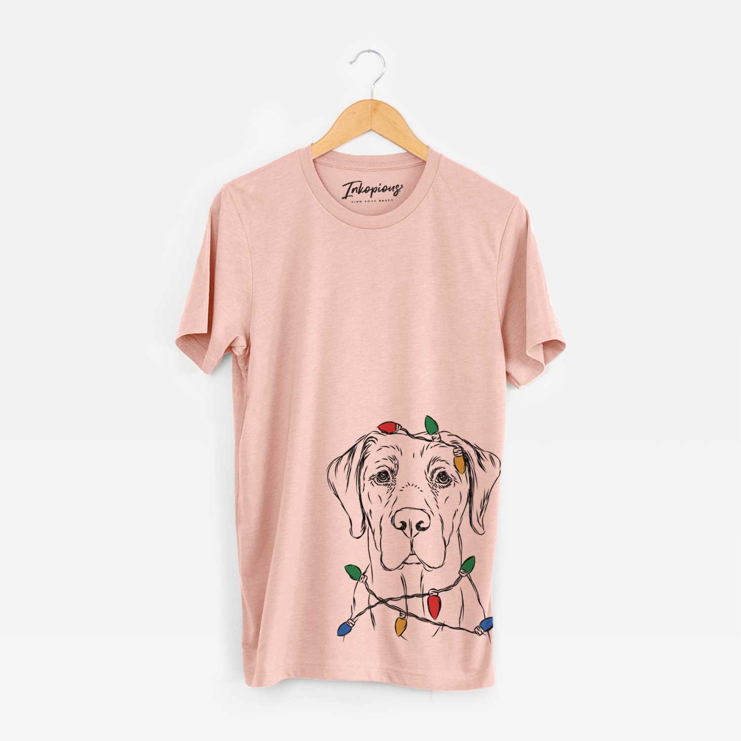 Hand-drawn sketch of Rowdy the Labrador Retriever wrapped in Christmas lights on a Peach Unisex crewneck