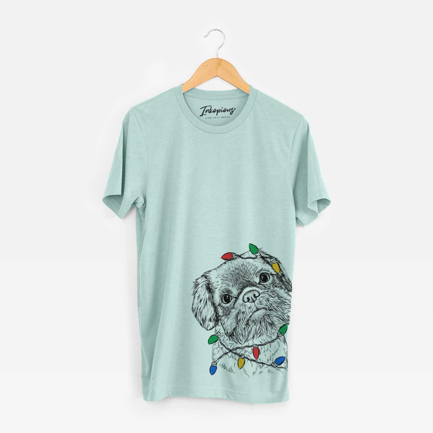 Hand-drawn sketch of Rufus the Shiffon wrapped in Christmas lights on a Heather Sage Unisex crewneck