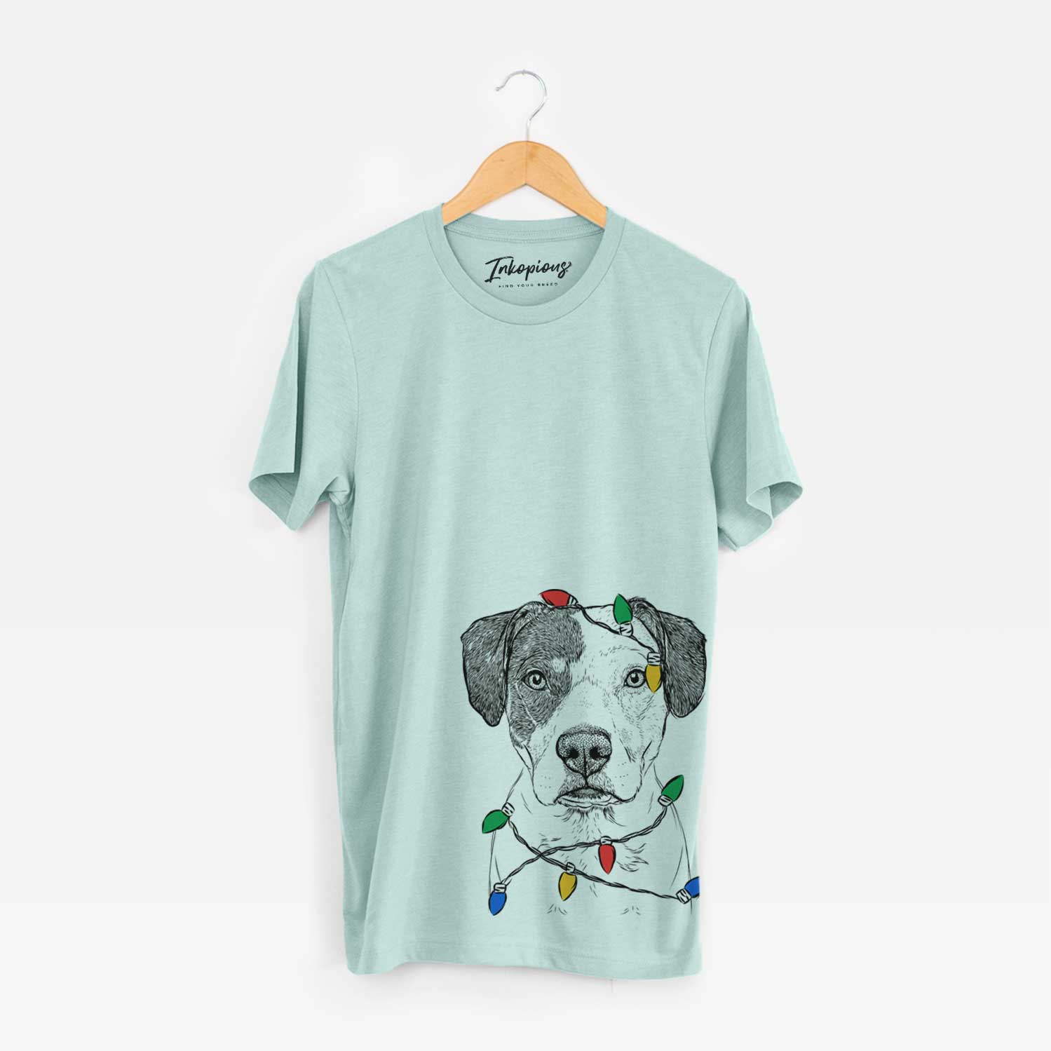 Hand-drawn sketch of Ryleigh the Beagle Pitbull Mix wrapped in Christmas lights on a Heather Sage Unisex crewneck