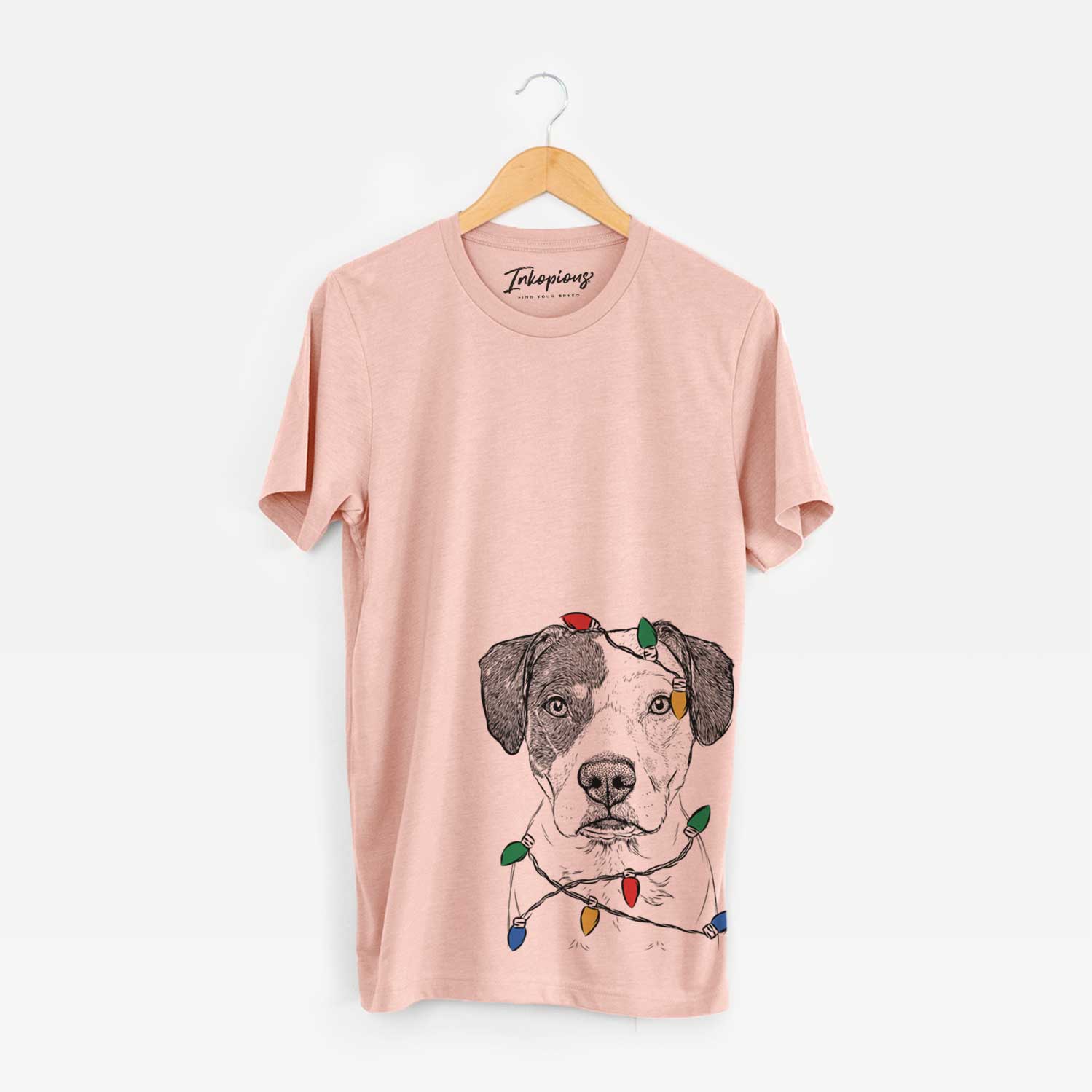 Hand-drawn sketch of Ryleigh the Beagle Pitbull Mix wrapped in Christmas lights on a Peach Unisex crewneck