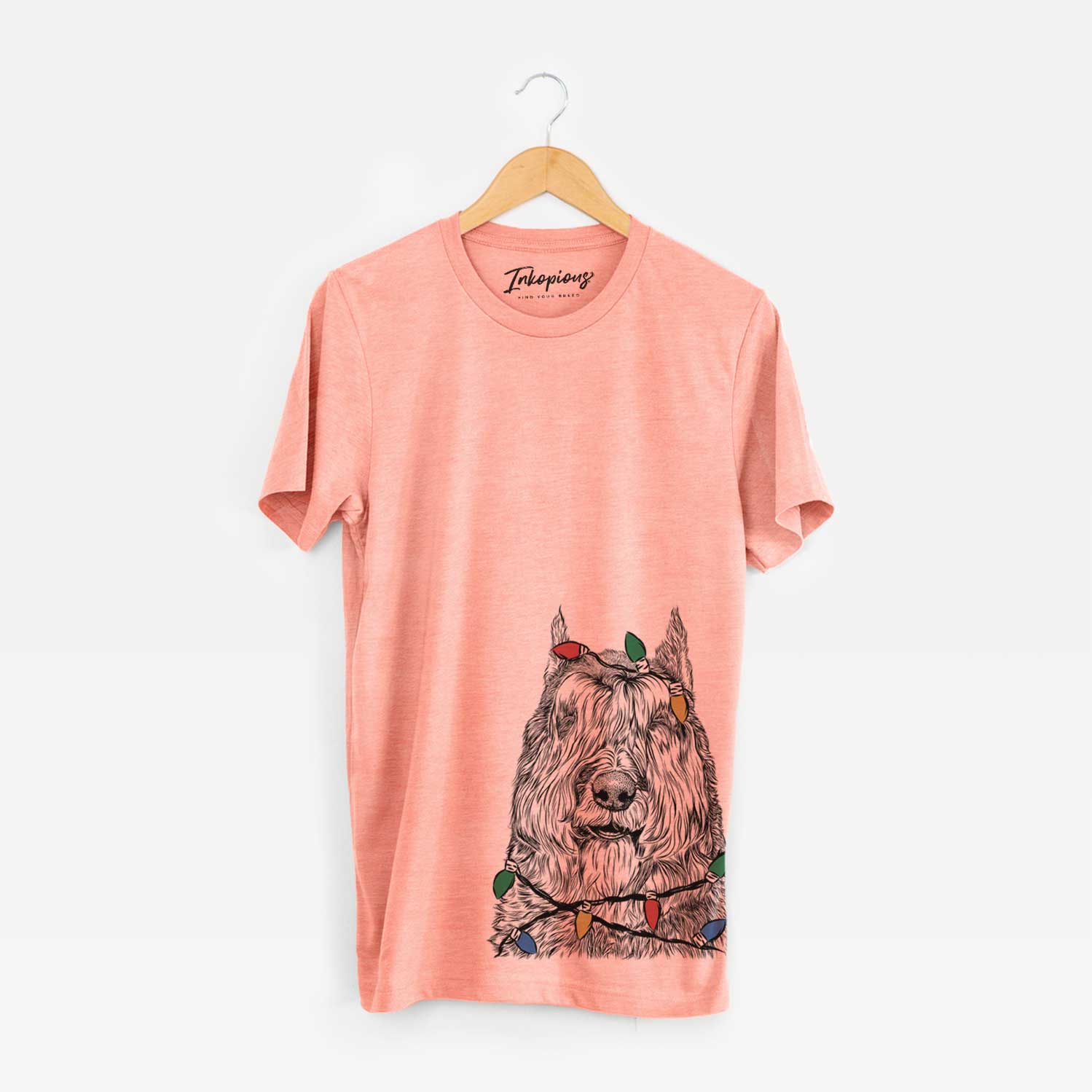 Hand-drawn sketch of Sabre the Bouvier Des Flandres wrapped in Christmas lights on a Sunset Unisex crewneck