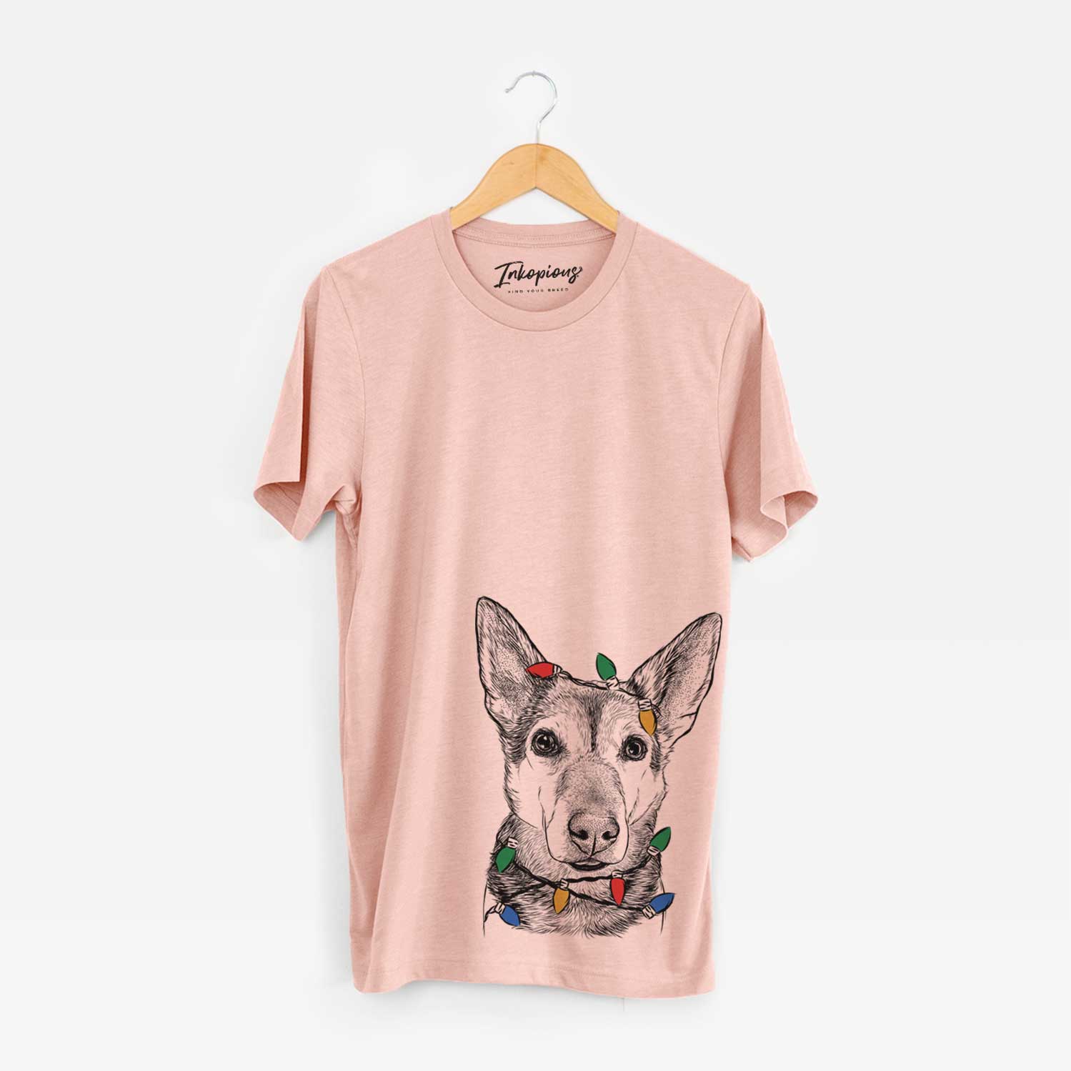 Hand-drawn sketch of Sammie the Mixed Breed wrapped in Christmas lights on a Peach Unisex crewneck