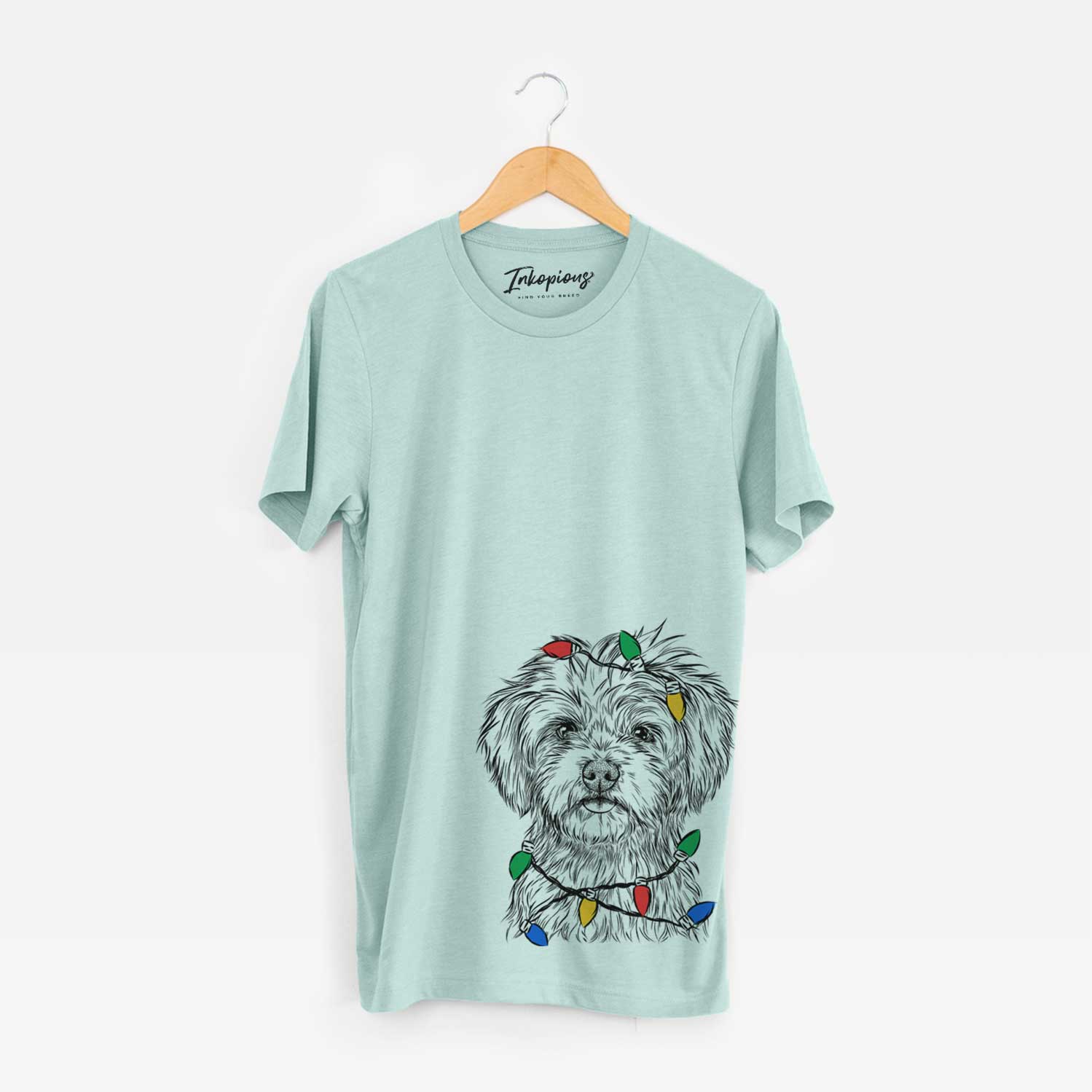 Hand-drawn sketch of Sammy the Shorkie wrapped in Christmas lights on a Heather Sage Unisex crewneck