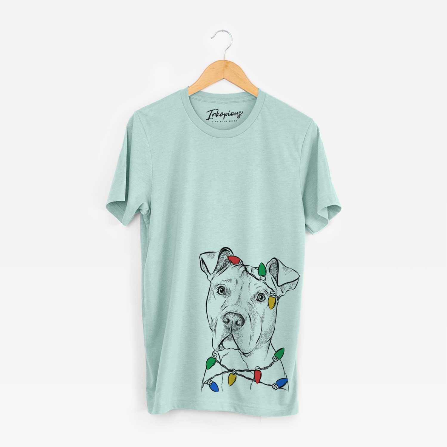Hand-drawn sketch of Scraps the American Staffordshire Mix wrapped in Christmas lights on a Heather Sage Unisex crewneck