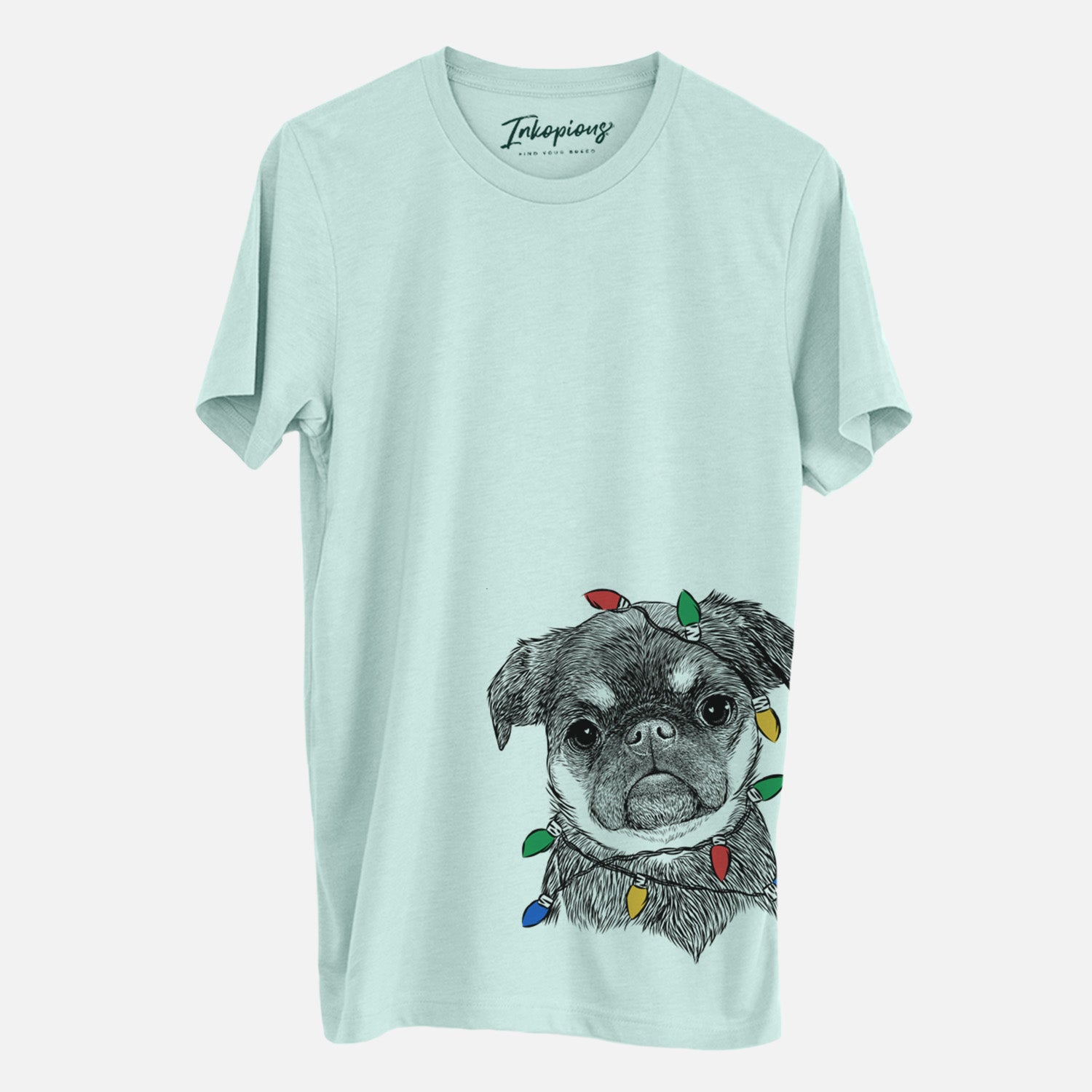 Hand-drawn sketch of Simone the Brussels Griffon wrapped in Christmas lights on a Heather Sage Unisex crewneck