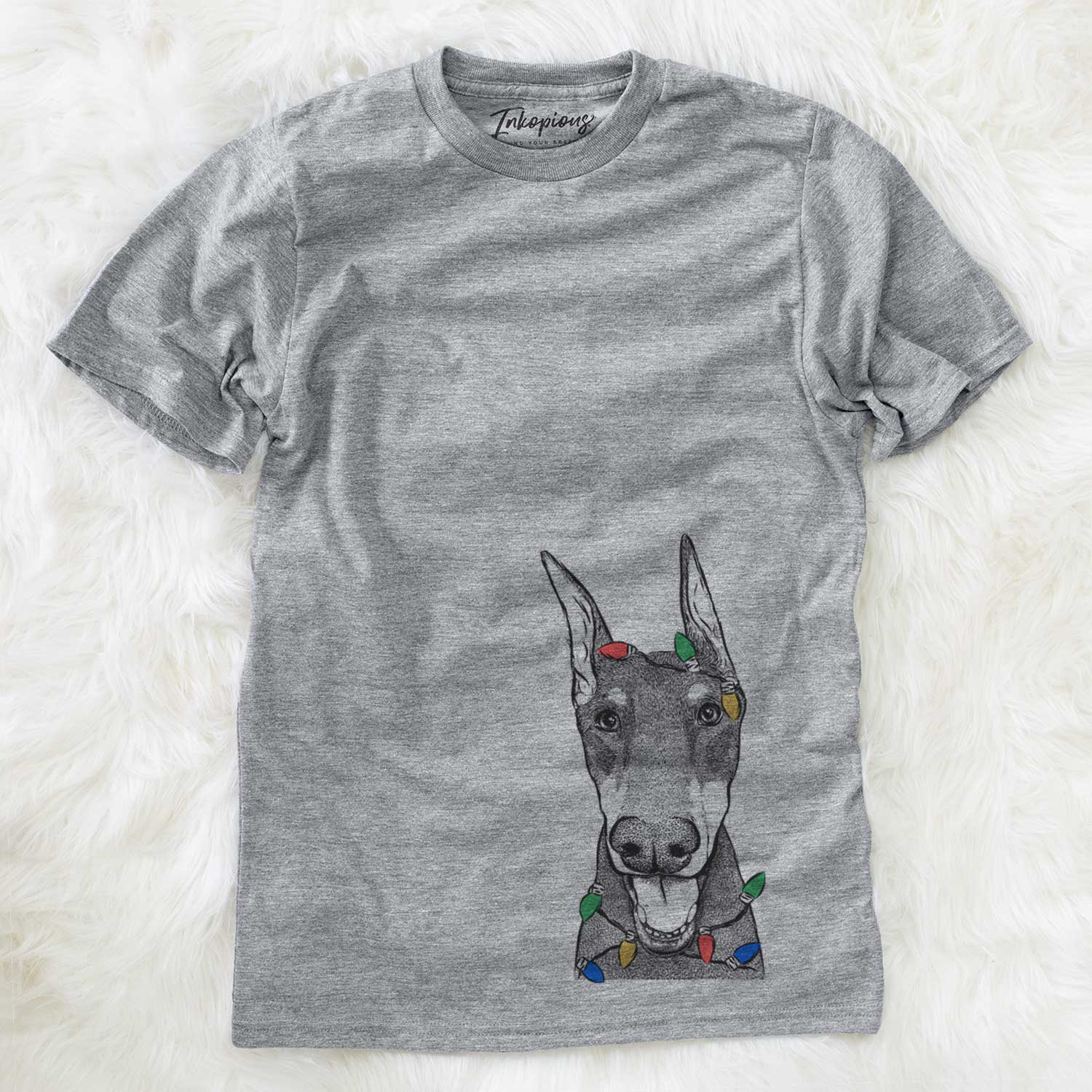 Hand-drawn sketch of Sir Duke the Doberman Pinscher wrapped in Christmas lights on a Grey Unisex crewneck
