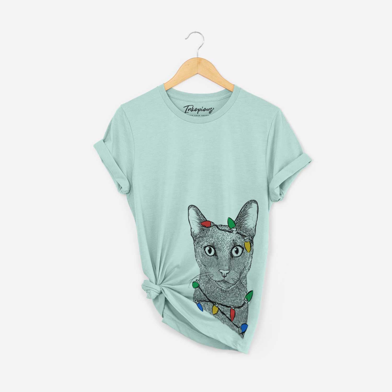 Hand-drawn sketch of Stanley the Russian Blue Cat wrapped in Christmas lights on a Heather Sage Unisex crewneck