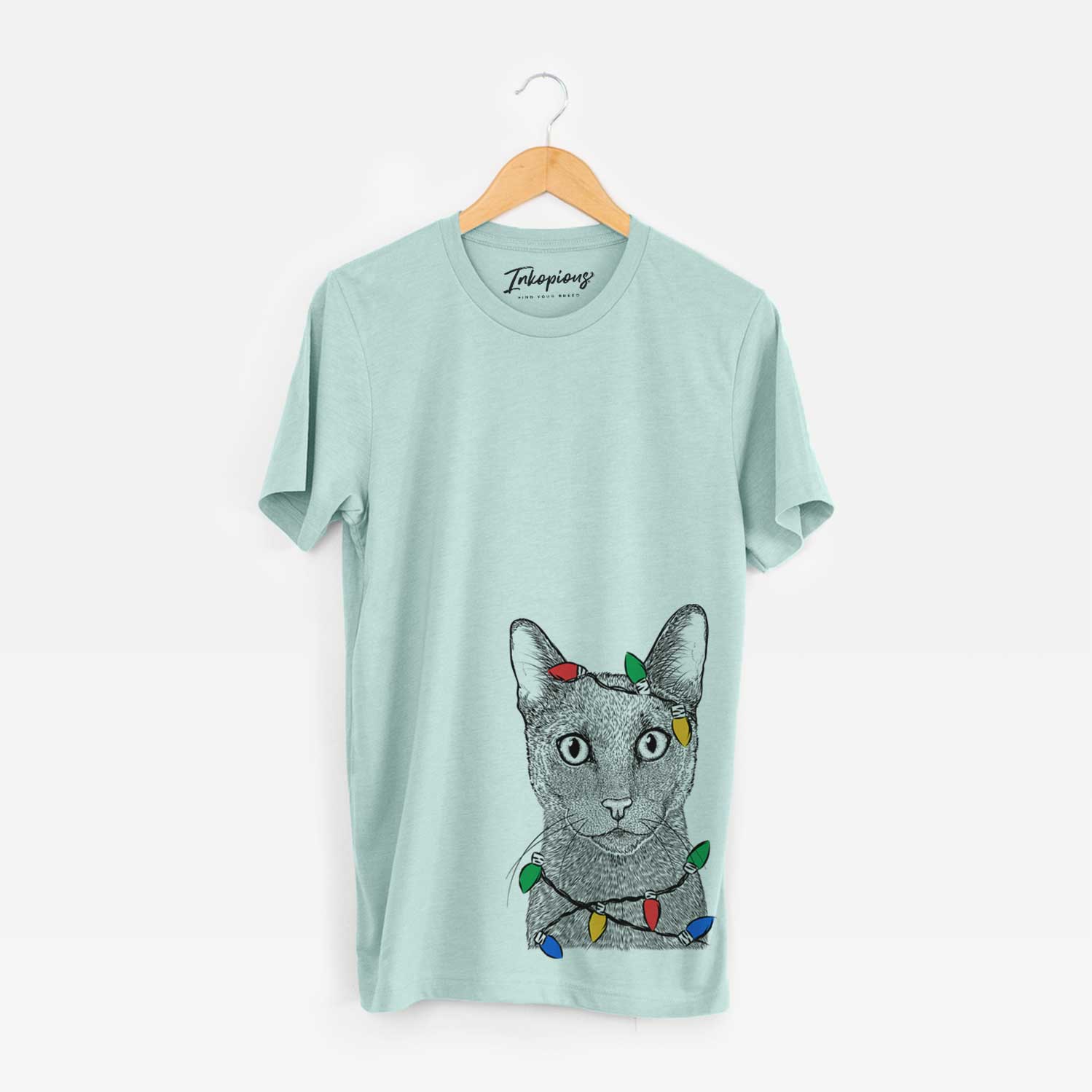 Hand-drawn sketch of Stanley the Russian Blue Cat wrapped in Christmas lights on a Heather Sage Unisex crewneck