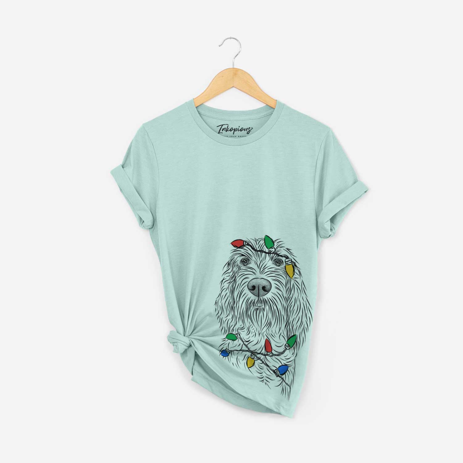 Hand-drawn sketch of Stefano the Spinone Italiano wrapped in Christmas lights on a Heather Sage Unisex crewneck