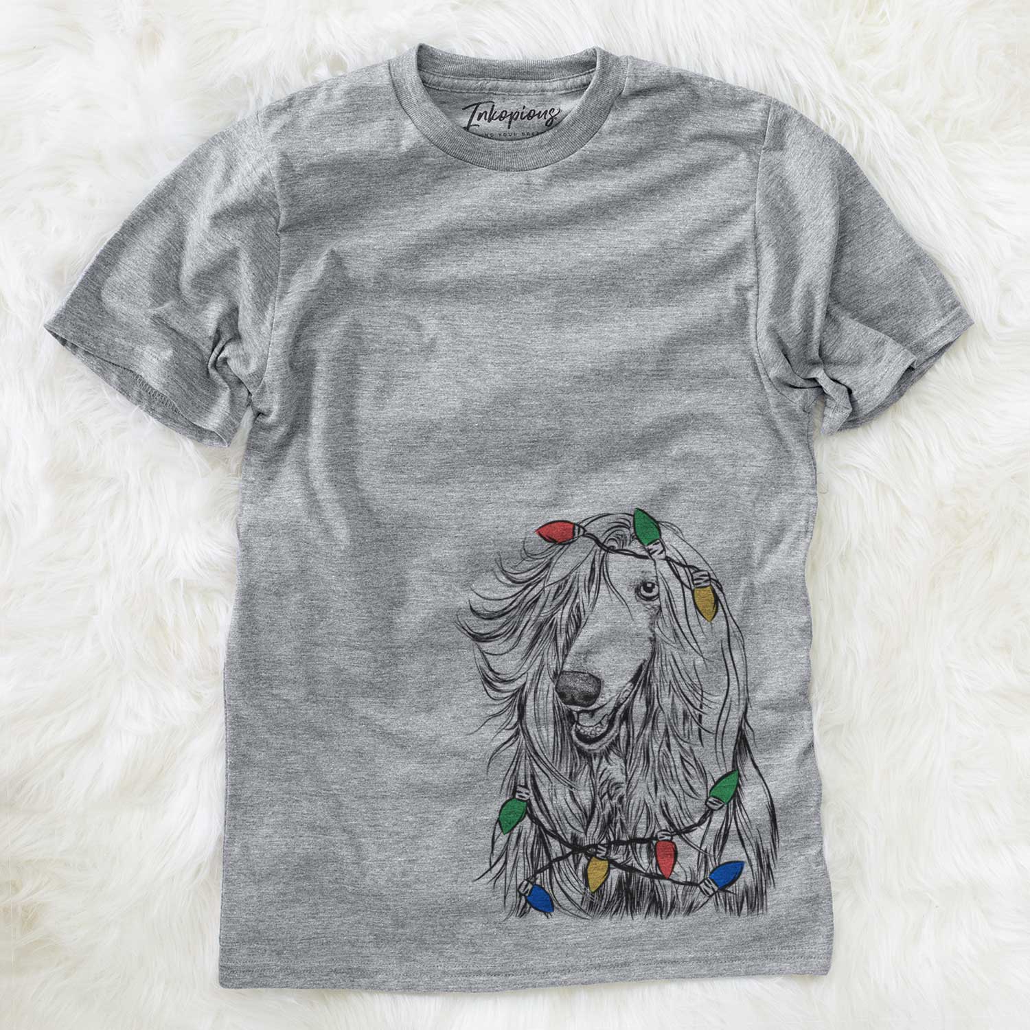 Hand-drawn sketch of Sterling the Afghan Hound wrapped in Christmas lights on a Grey Unisex crewneck