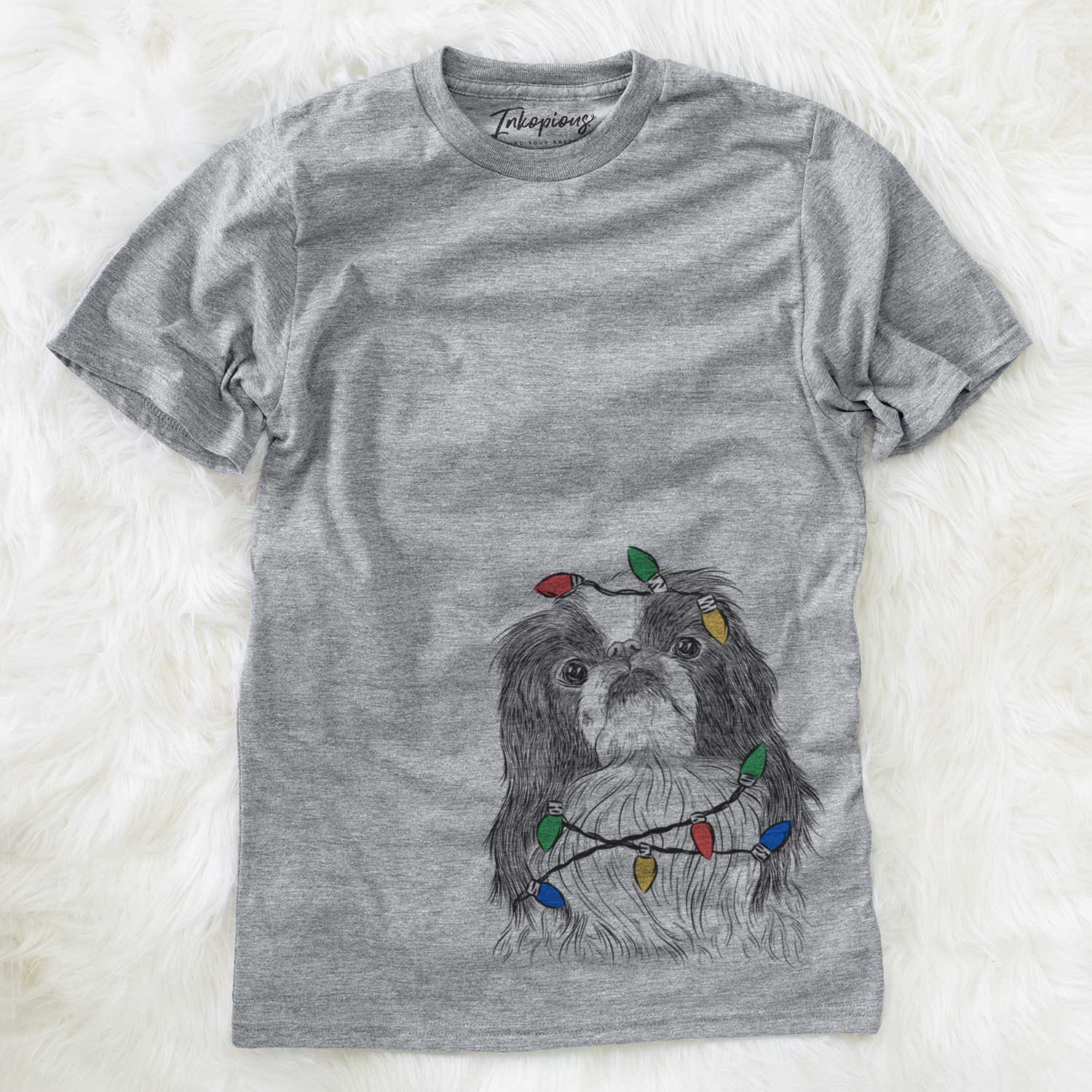Hand-drawn sketch of Suki the Japanese Chin wrapped in Christmas lights on a Grey Unisex crewneck