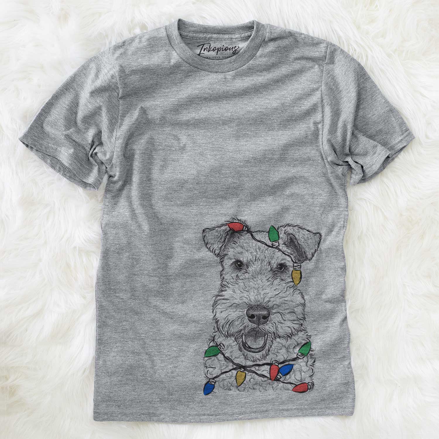 Hand-drawn sketch of Ted the Wire Fox Terrier wrapped in Christmas lights on a Grey Unisex crewneck