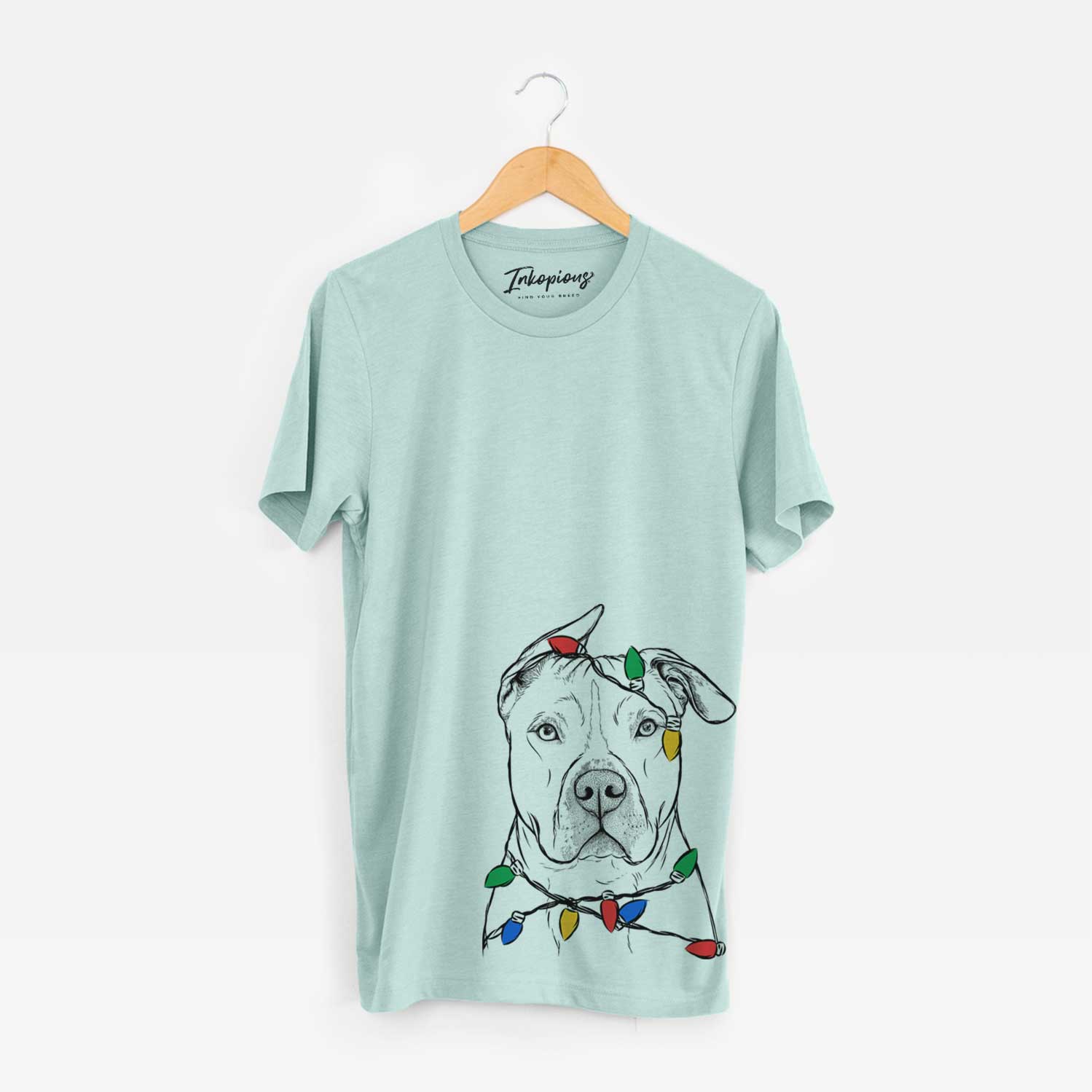 Hand-drawn sketch of Teddy Jam the Pitbull wrapped in Christmas lights on a Heather Sage Unisex crewneck