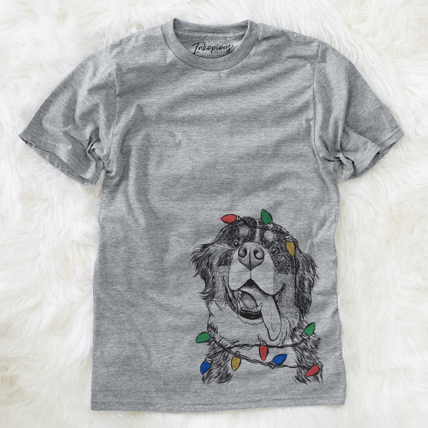 Hand-drawn sketch of Theo the Bernese Mountain Dog wrapped in Christmas lights on a Grey Unisex crewneck