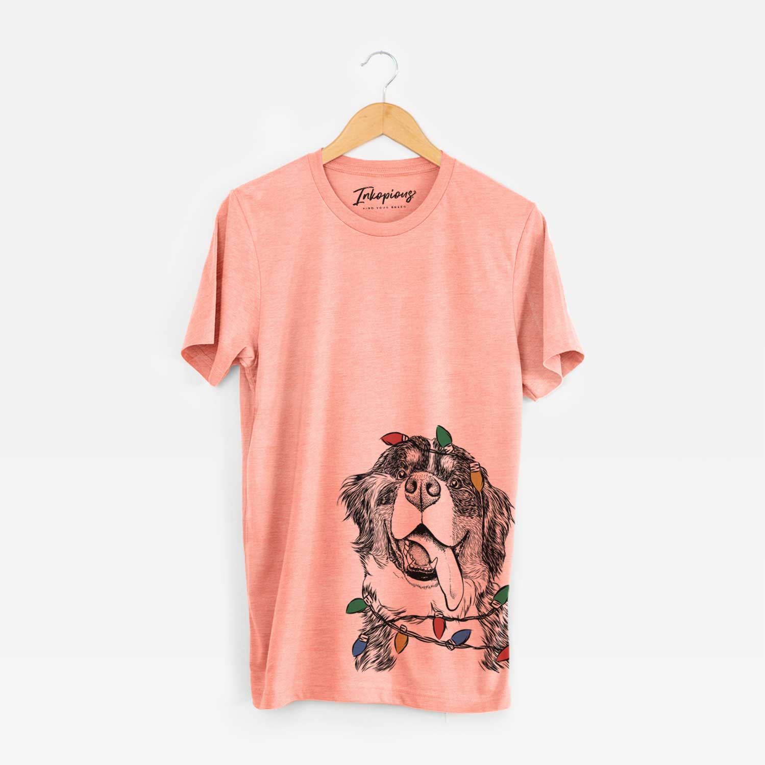 Hand-drawn sketch of Theo the Bernese Mountain Dog wrapped in Christmas lights on a Sunset Unisex crewneck