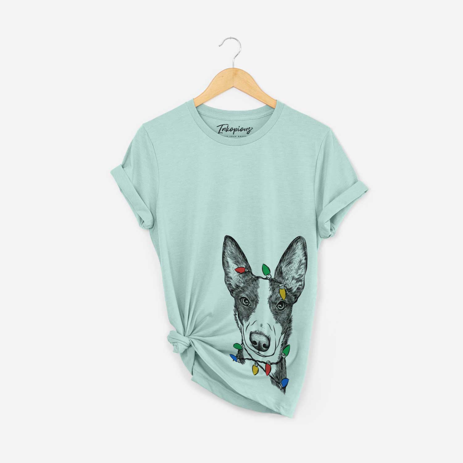 Hand-drawn sketch of Tigm the Bippet wrapped in Christmas lights on a Heather Sage Unisex crewneck