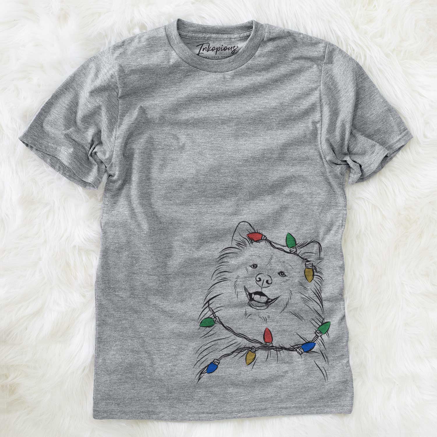 Hand-drawn sketch of Tillie the Samoyed wrapped in Christmas lights on a Grey Unisex crewneck