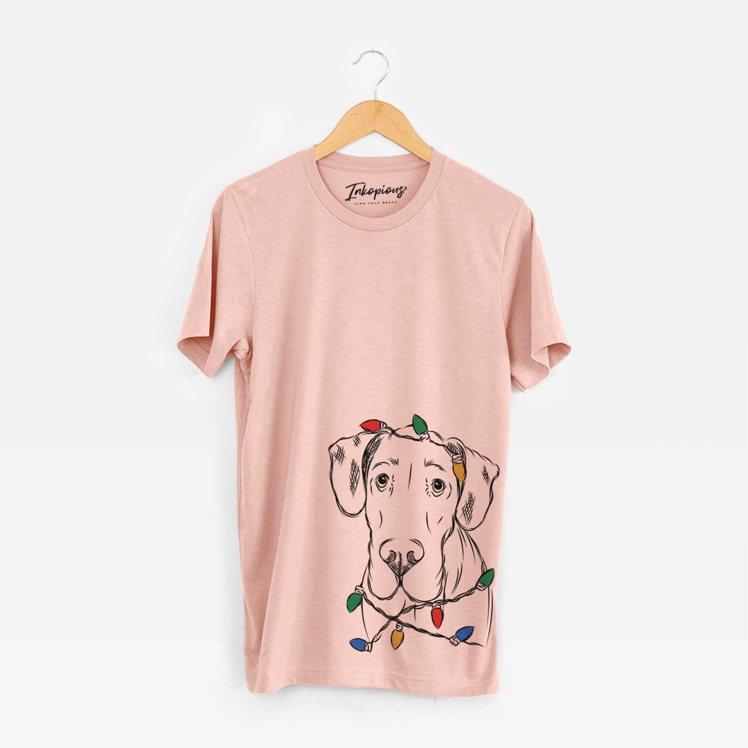 Hand-drawn sketch of Titus the Great Dane wrapped in Christmas lights on a Peach Unisex crewneck