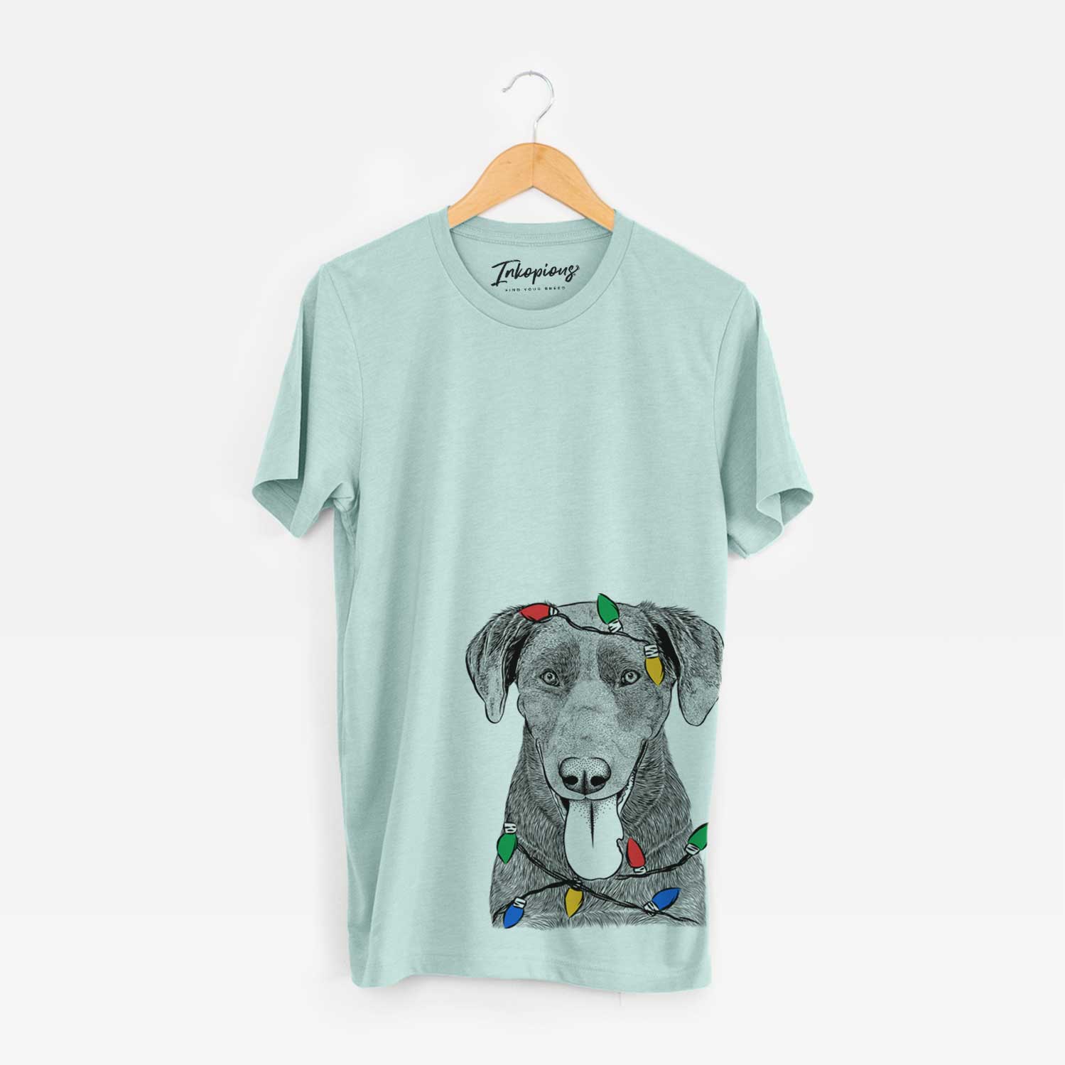 Hand-drawn sketch of Tobes the Chocolate Lab wrapped in Christmas lights on a Heather Sage Unisex crewneck