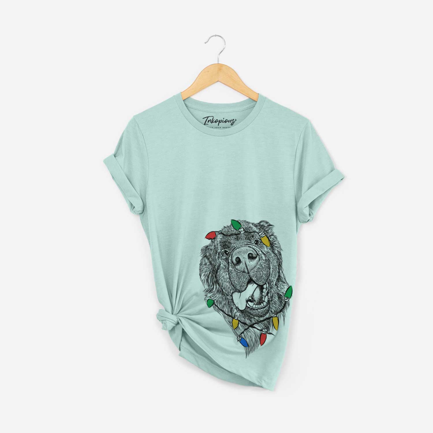 Hand-drawn sketch of Tuna the Newfoundland wrapped in Christmas lights on a Heather Sage Unisex crewneck