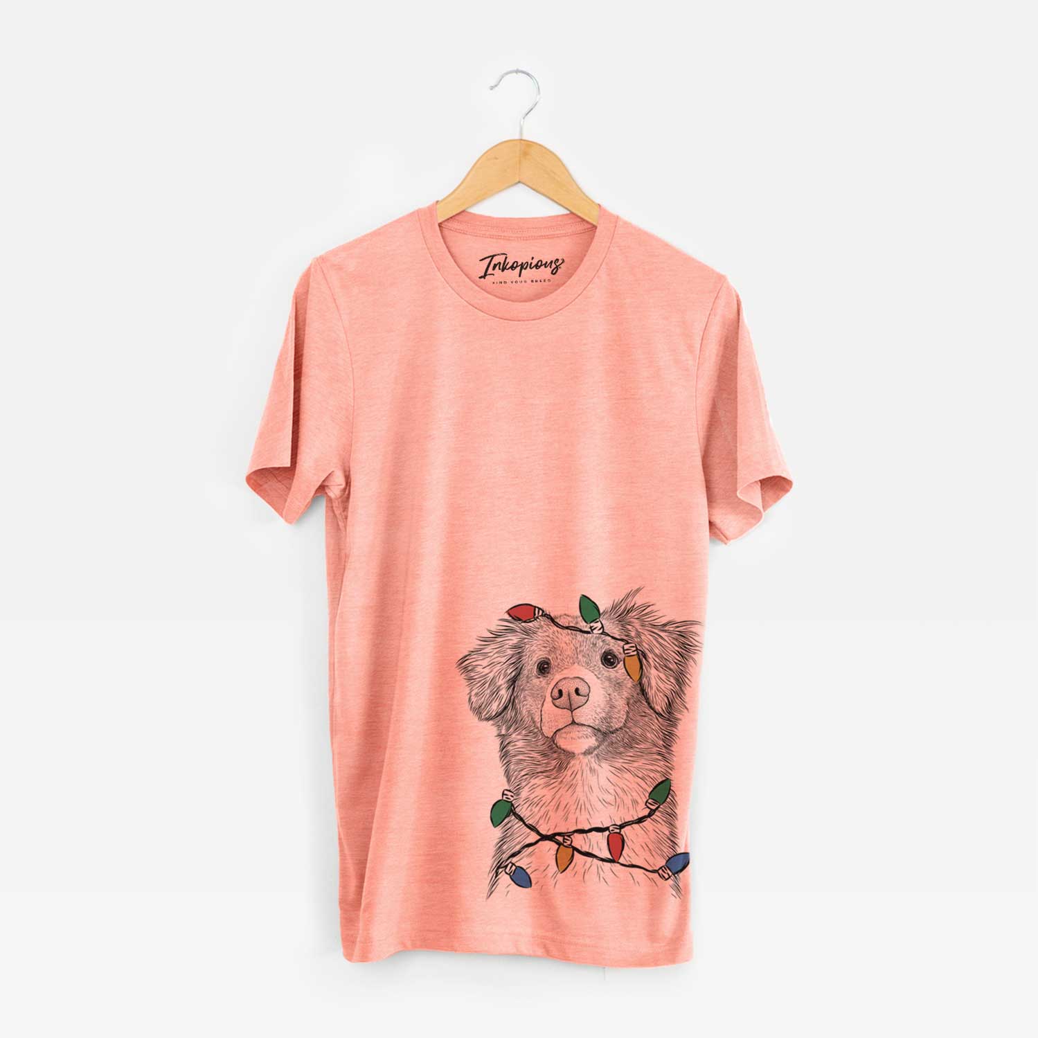 Hand-drawn sketch of Vixen the Nova Scotia Duck Tolling Retriever wrapped in Christmas lights on a Sunset Unisex crewneck