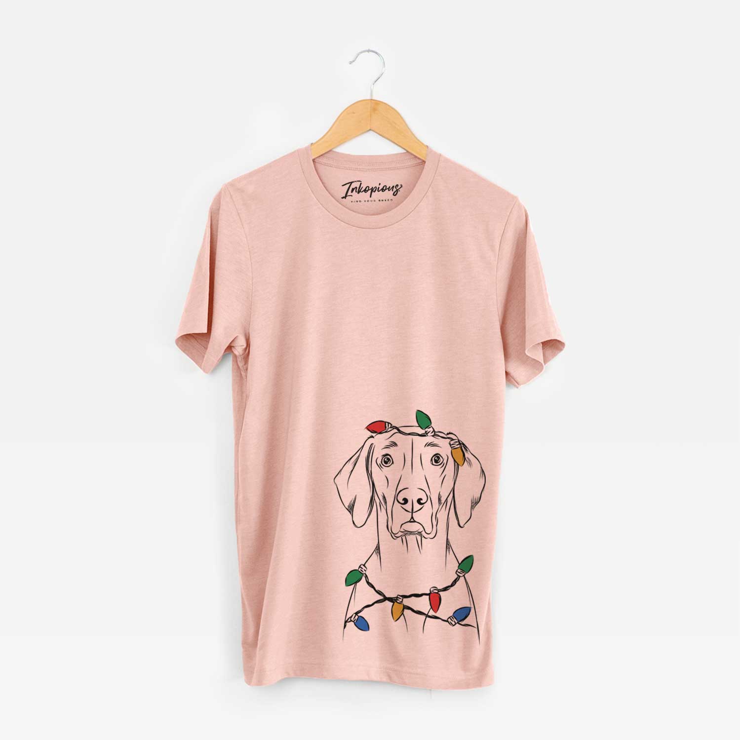 Hand-drawn sketch of Walter the Weimaraner wrapped in Christmas lights on a Peach Unisex crewneck