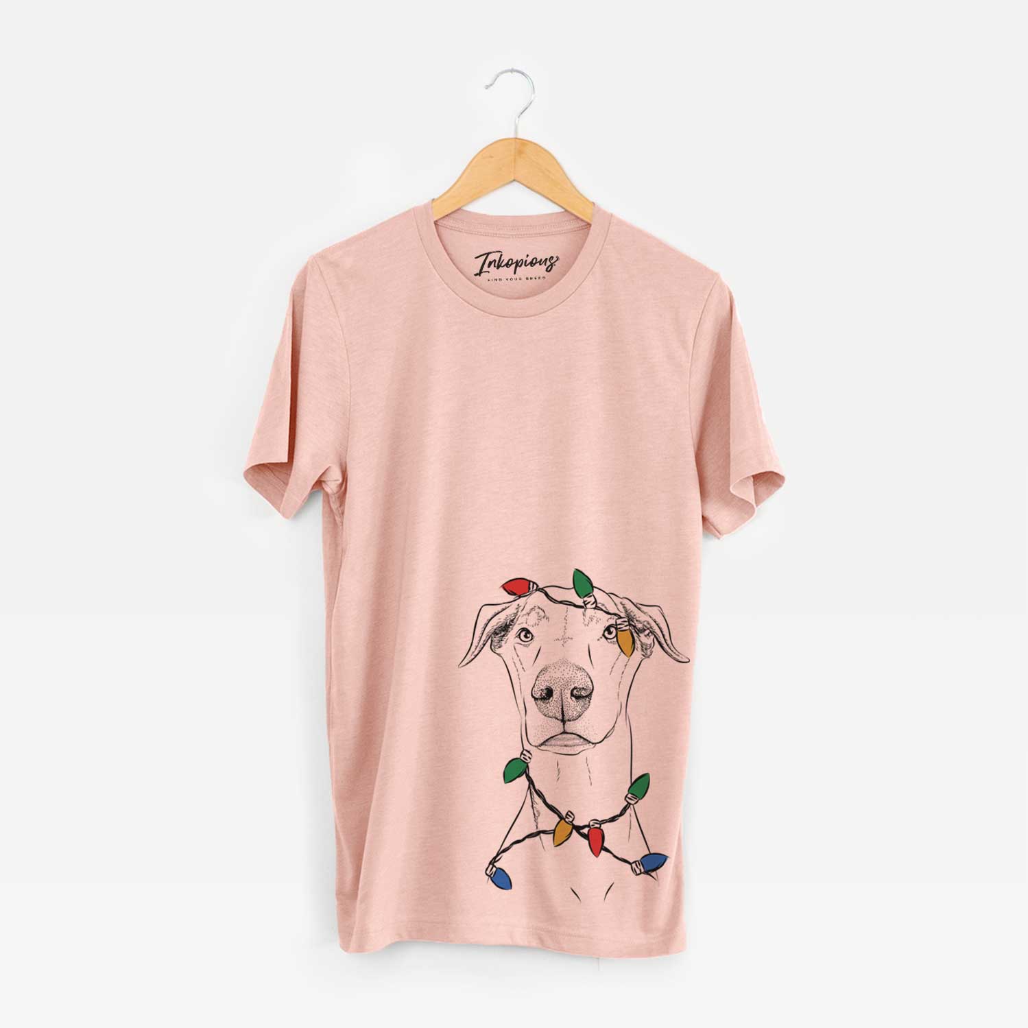 Hand-drawn sketch of Walter the White Doberman Rescue wrapped in Christmas lights on a Peach Unisex crewneck