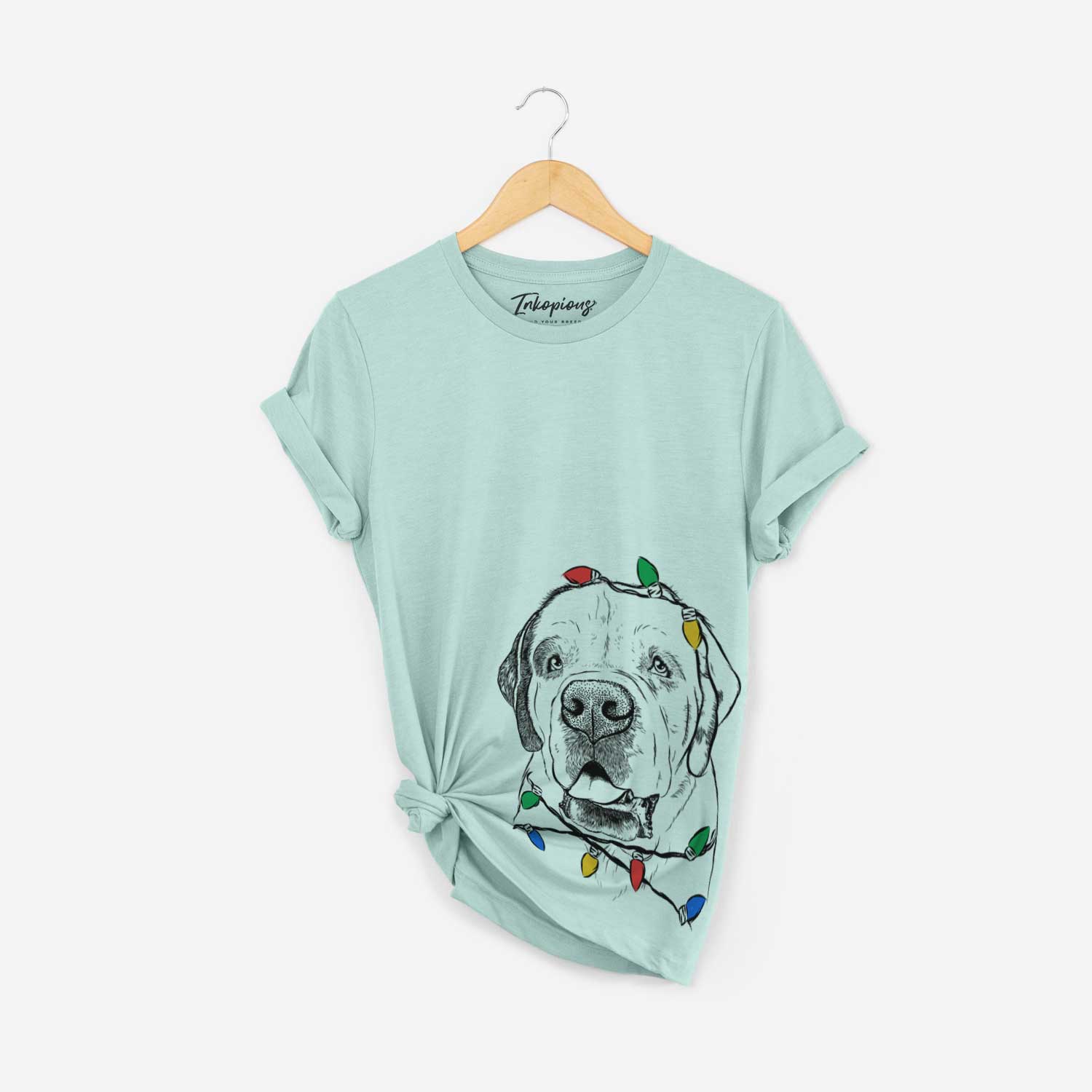 Hand-drawn sketch of Wendy the Saint Bernard wrapped in Christmas lights on a Heather Sage Unisex crewneck